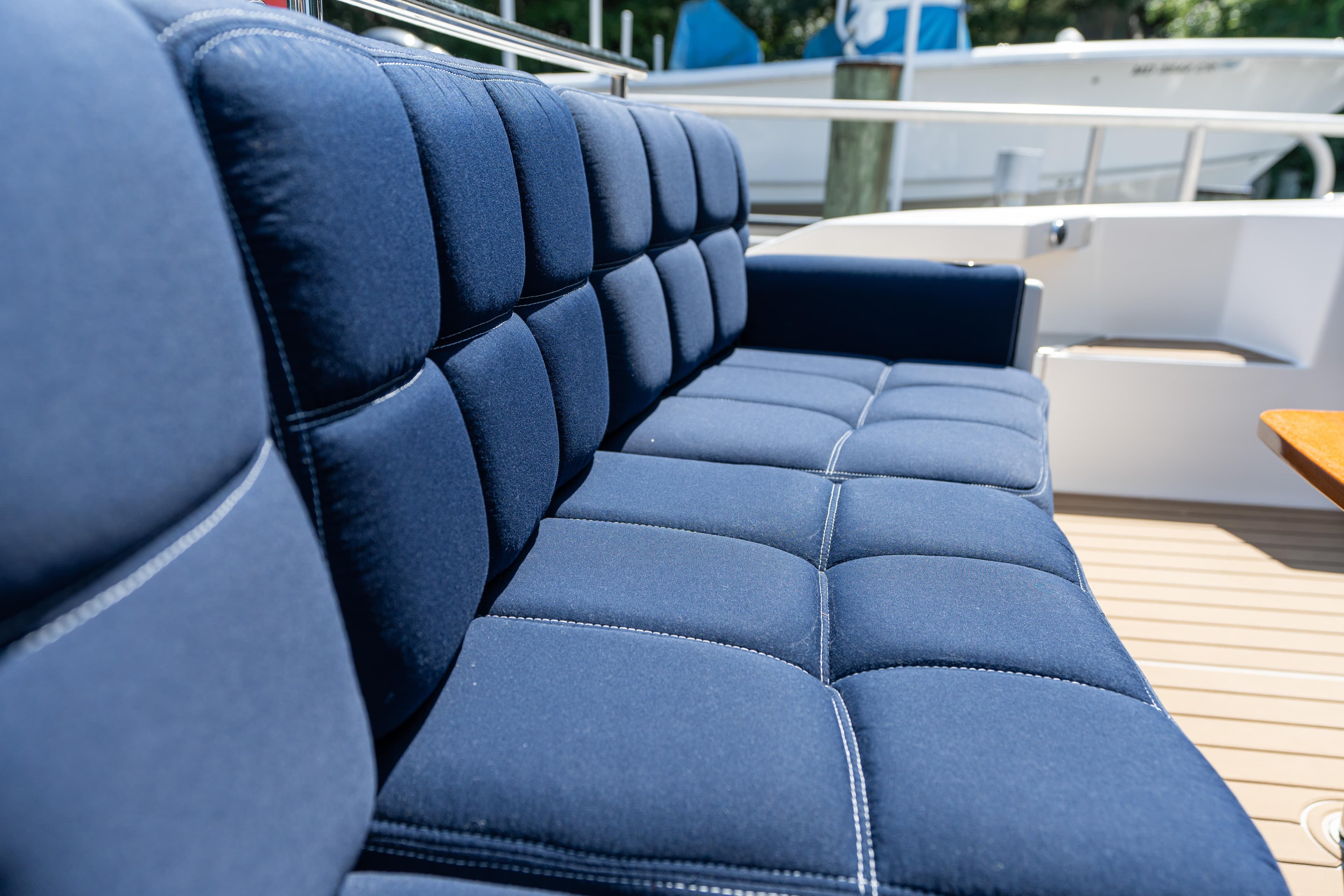 Luxurious blue seating on 2015 Tiara Yachts C44 Coupe deck.