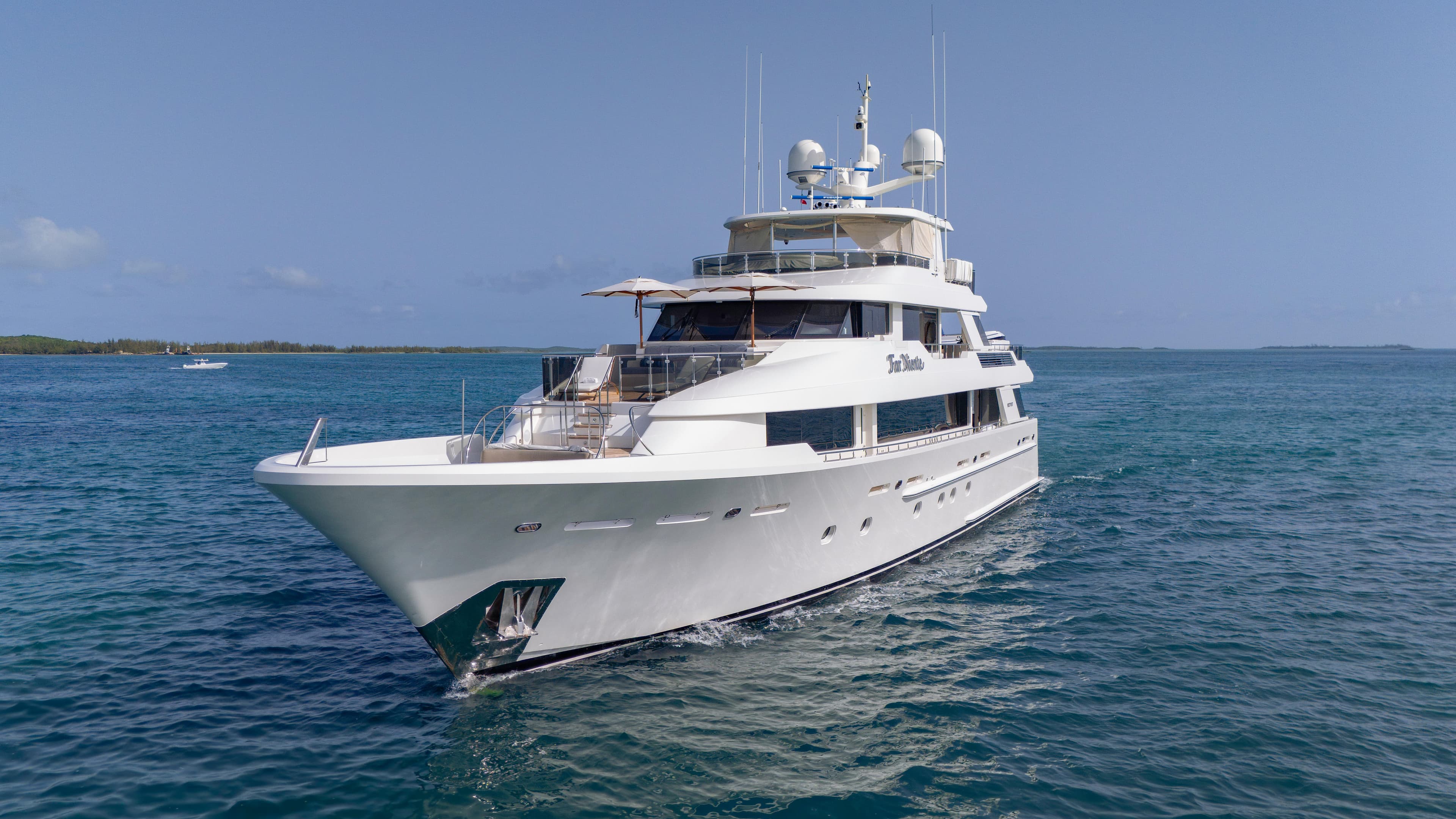 Luxurious 2014 Westport 40M yacht cruising on clear blue waters.
