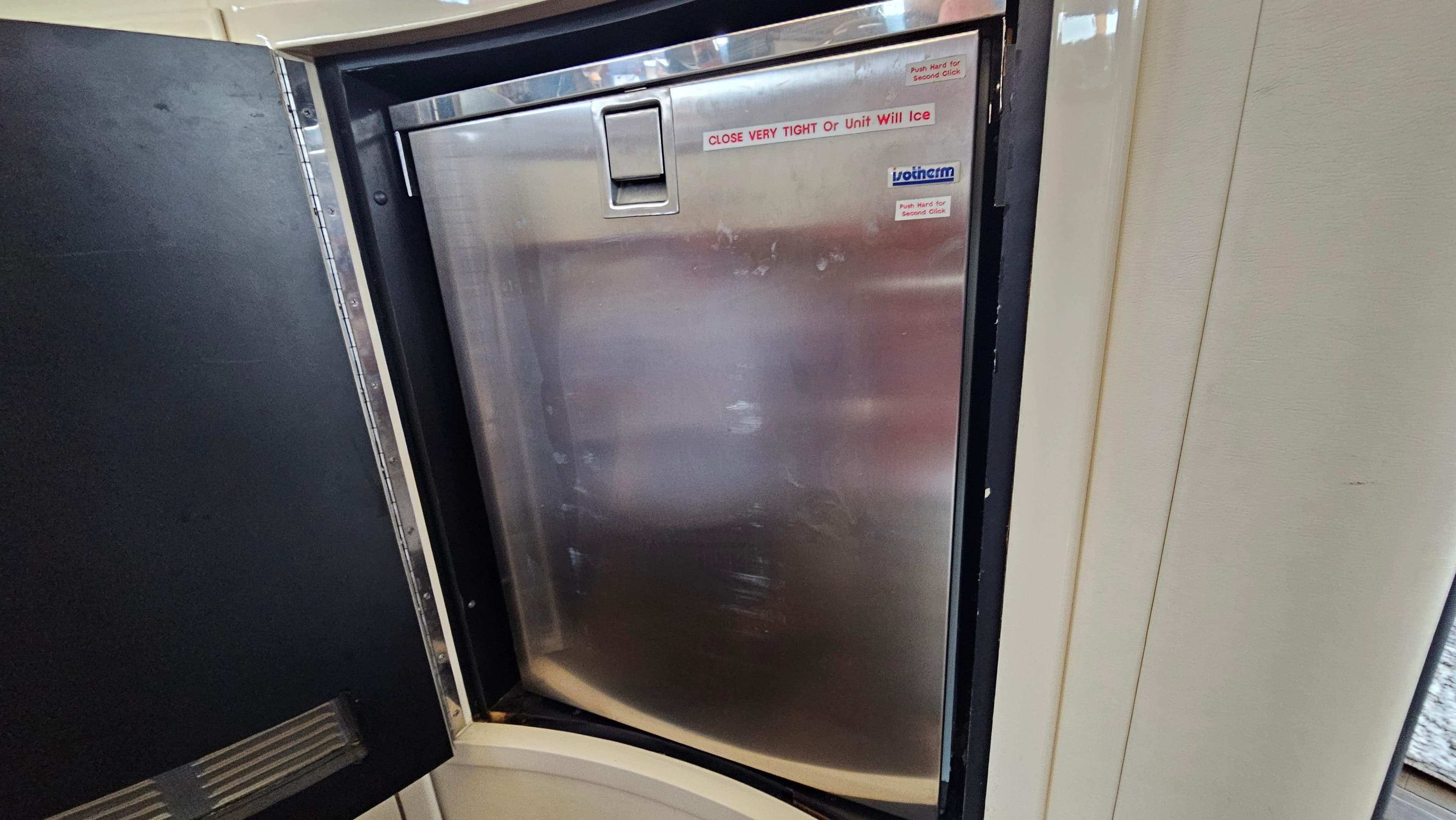 Stainless steel refrigerator inside 2005 Neptunus 56 Flybridge yacht.