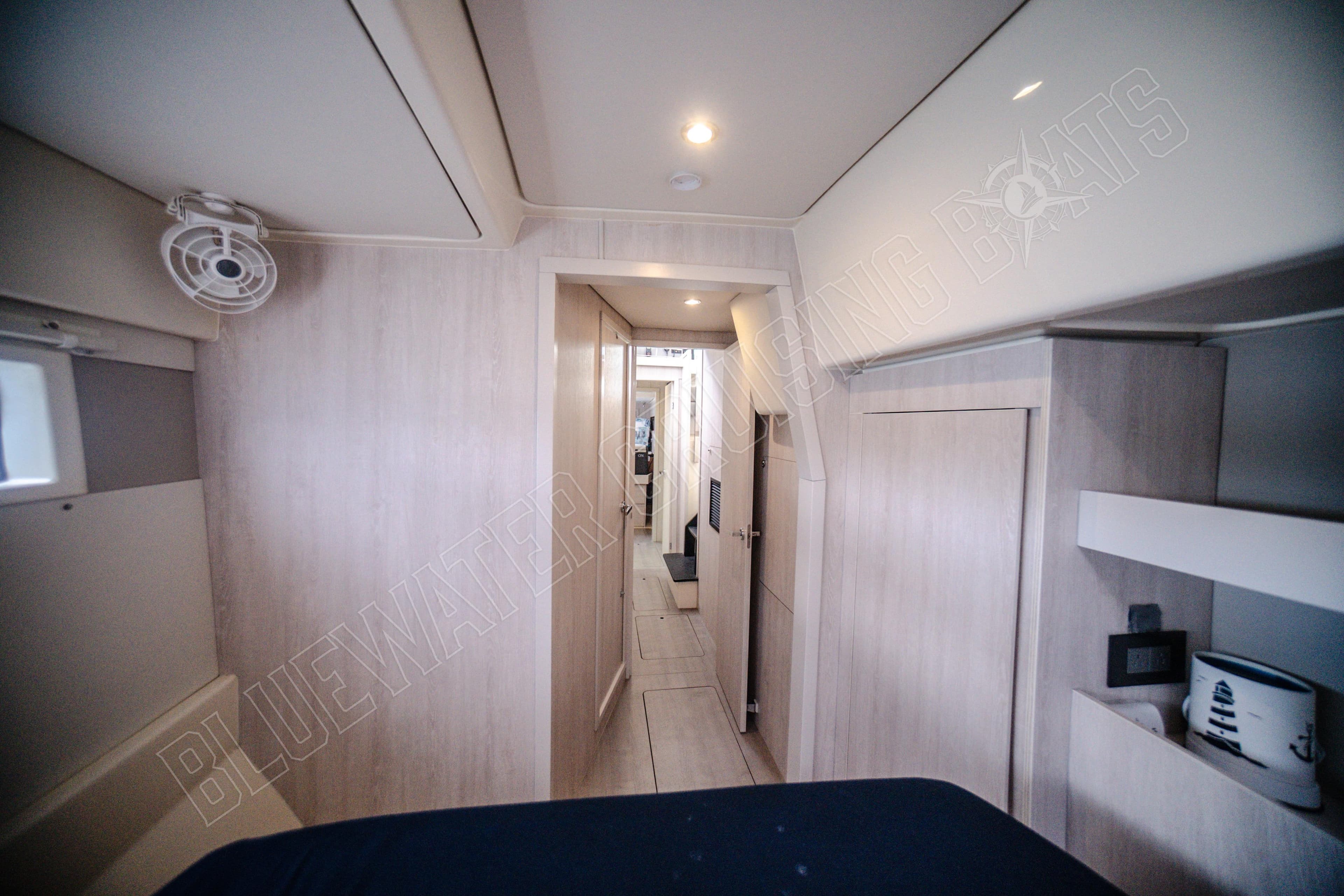 Interior of 2015 Leopard 48 yacht, featuring modern design and spacious hallway.