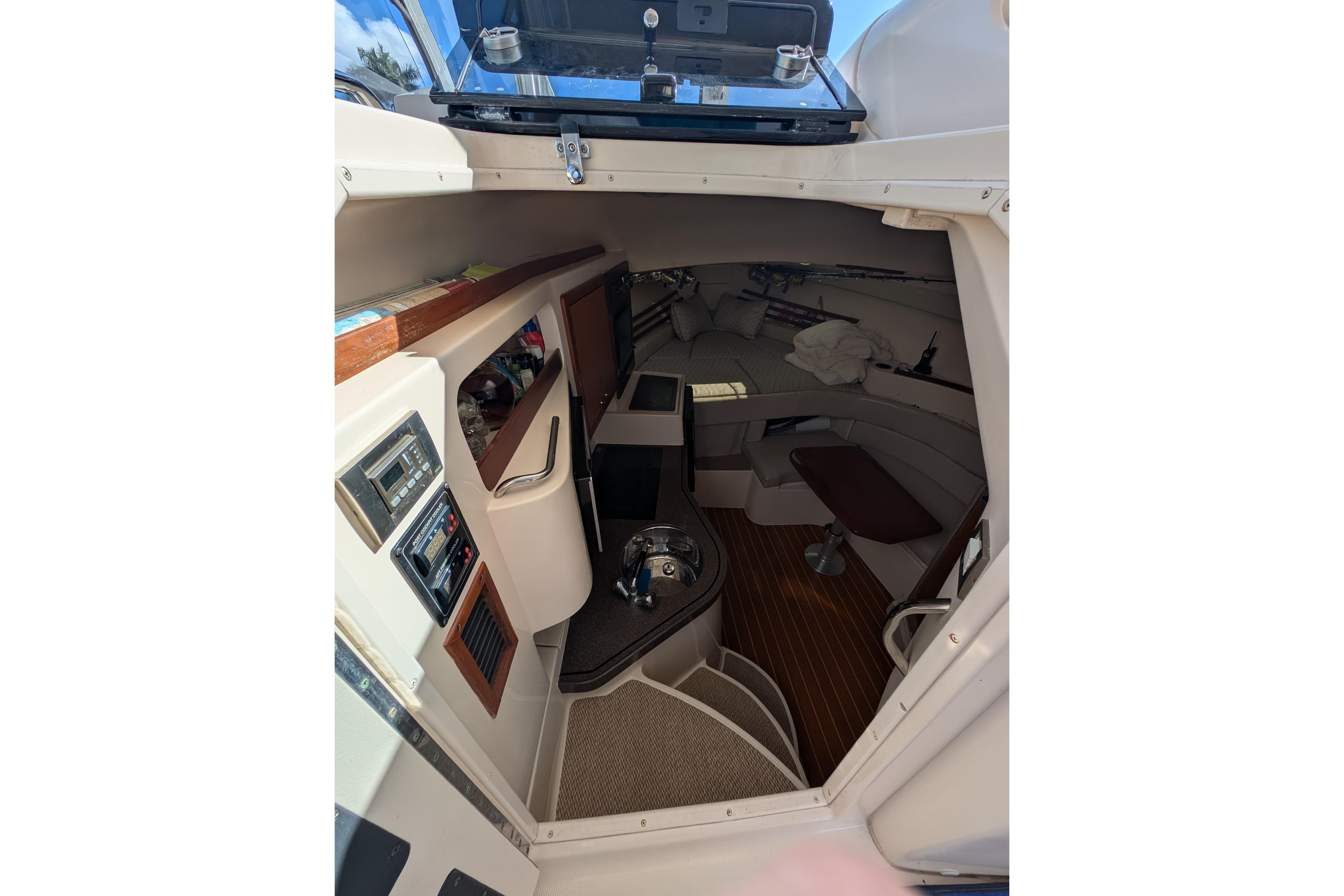 2010 Grady-White Express 330 cabin interior with seating and control panels.