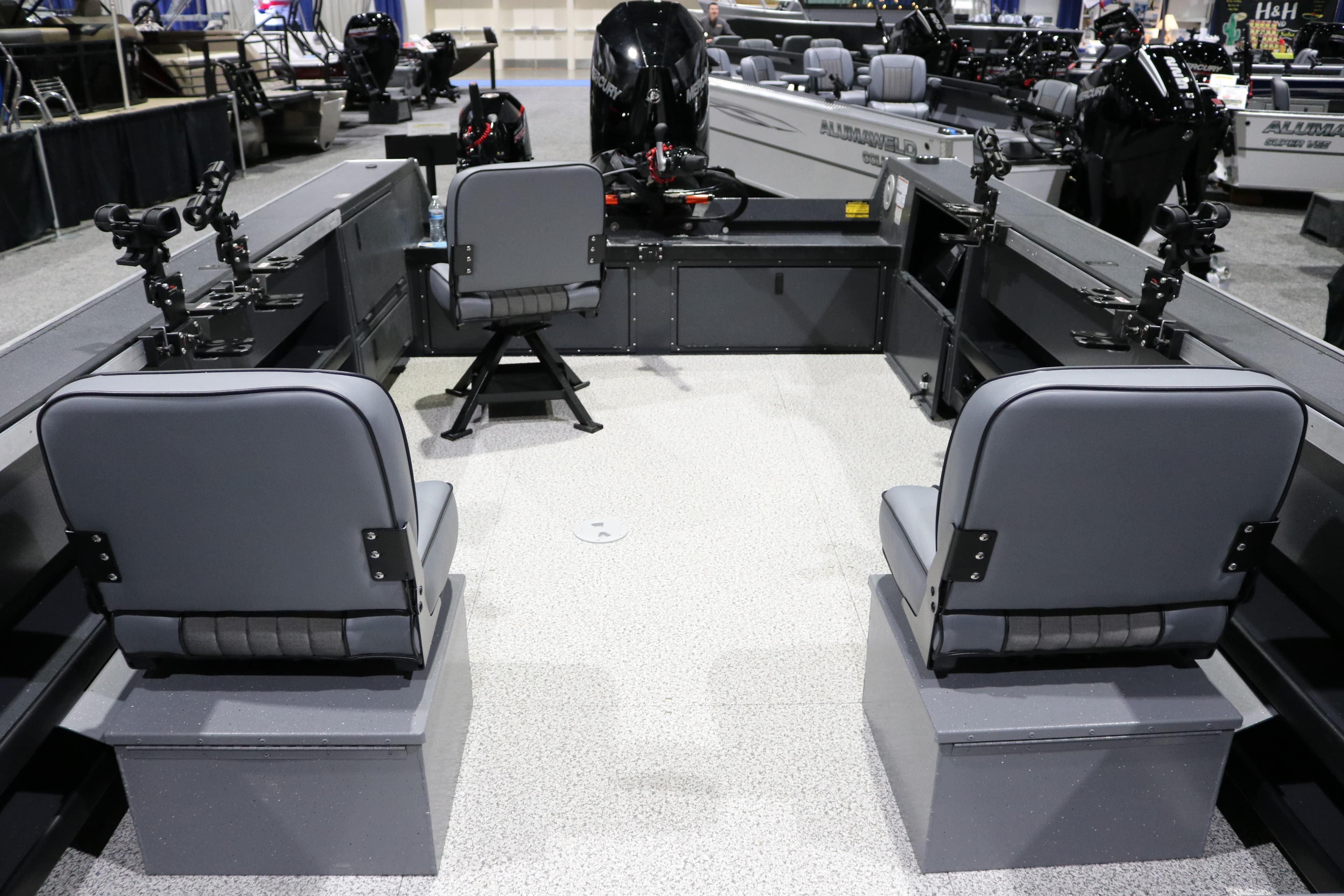 2026 Alumaweld Columbia XL 26 boat interior with seating and fishing rod holders.