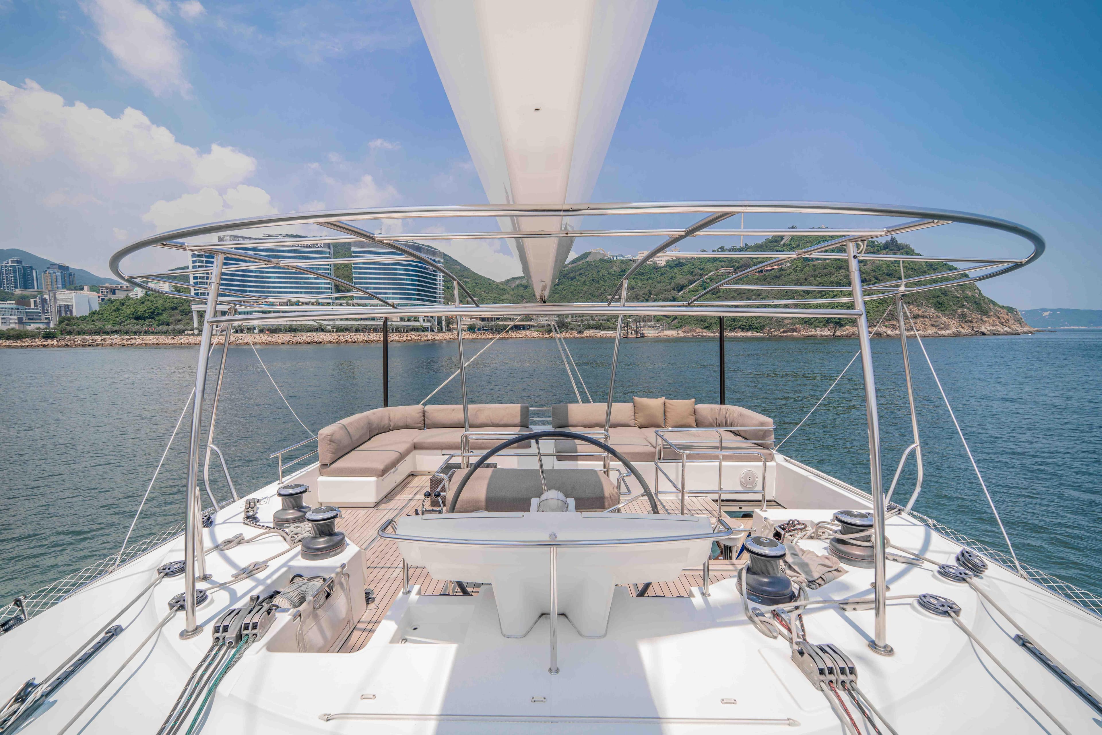 Luxurious 2015 Lagoon 560 S2 yacht with spacious deck and scenic ocean view.