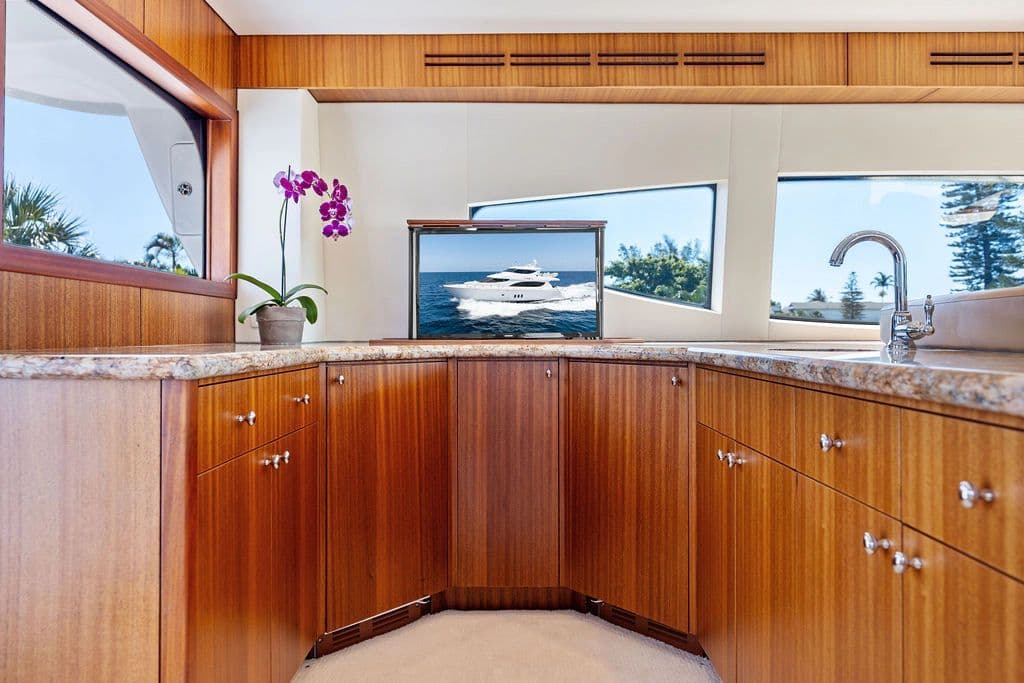 Interior of 2013 Hatteras 80 Motor Yacht with wooden cabinetry.