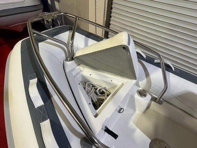 2021 Novurania 360 DL boat bow with anchor storage and stainless steel railings.