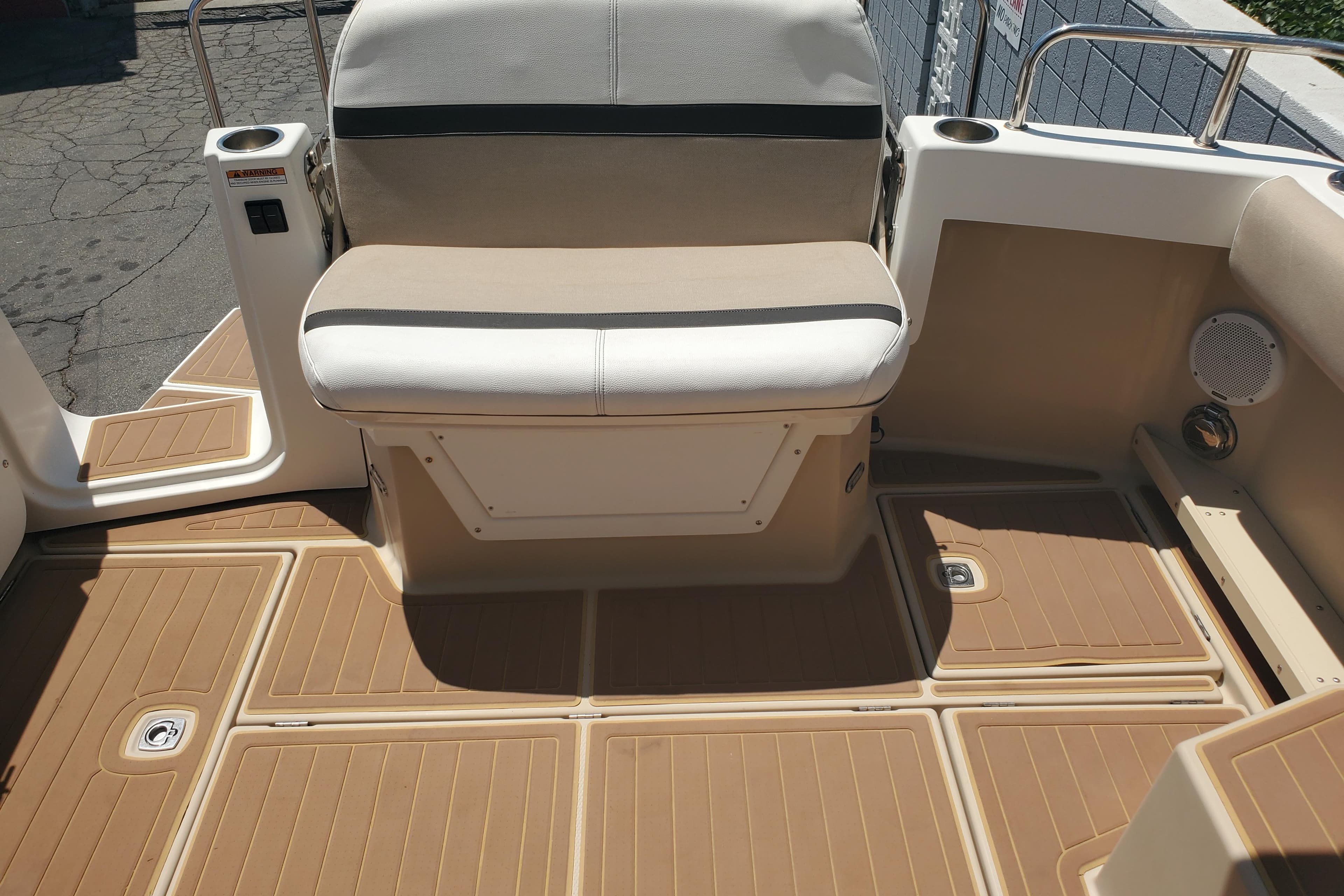 2013 Cutwater 26 boat interior with beige seating and non-slip flooring.