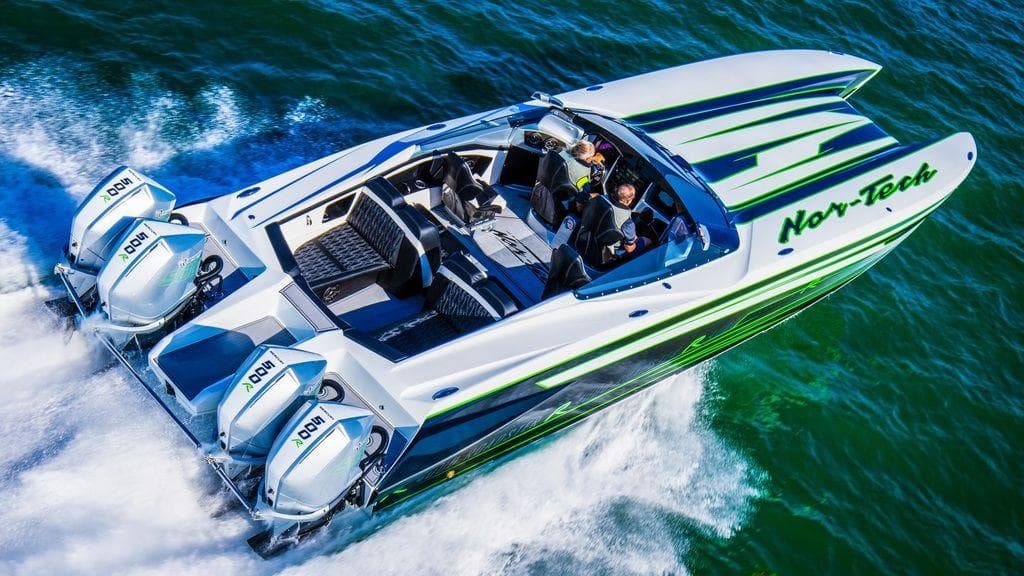 2025 Nor-Tech 4000 Supercat speedboat cruising on water, featuring sleek design and powerful engines.