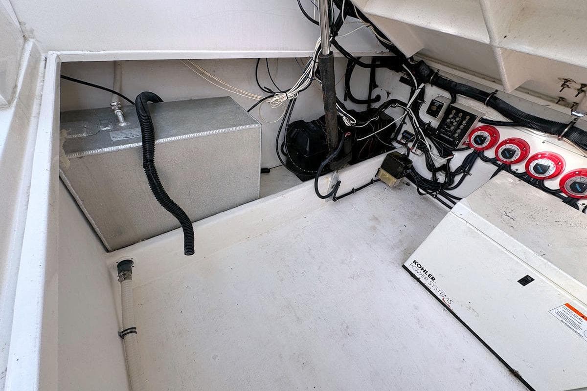 2005 Contender 35 Express Side Console engine compartment with wiring and equipment.