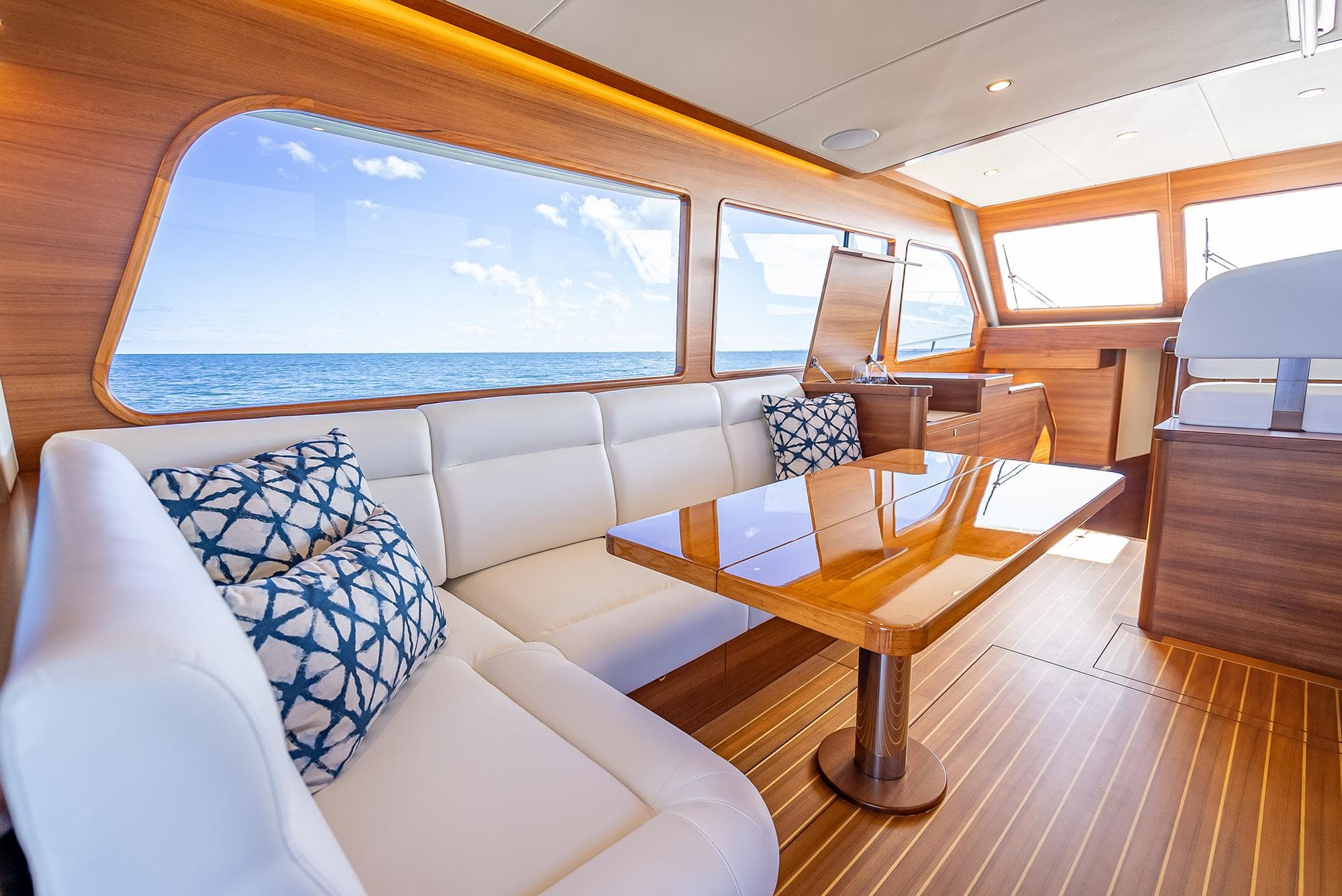 Luxurious interior of 2026 Grand Banks GB 54 yacht with ocean view.