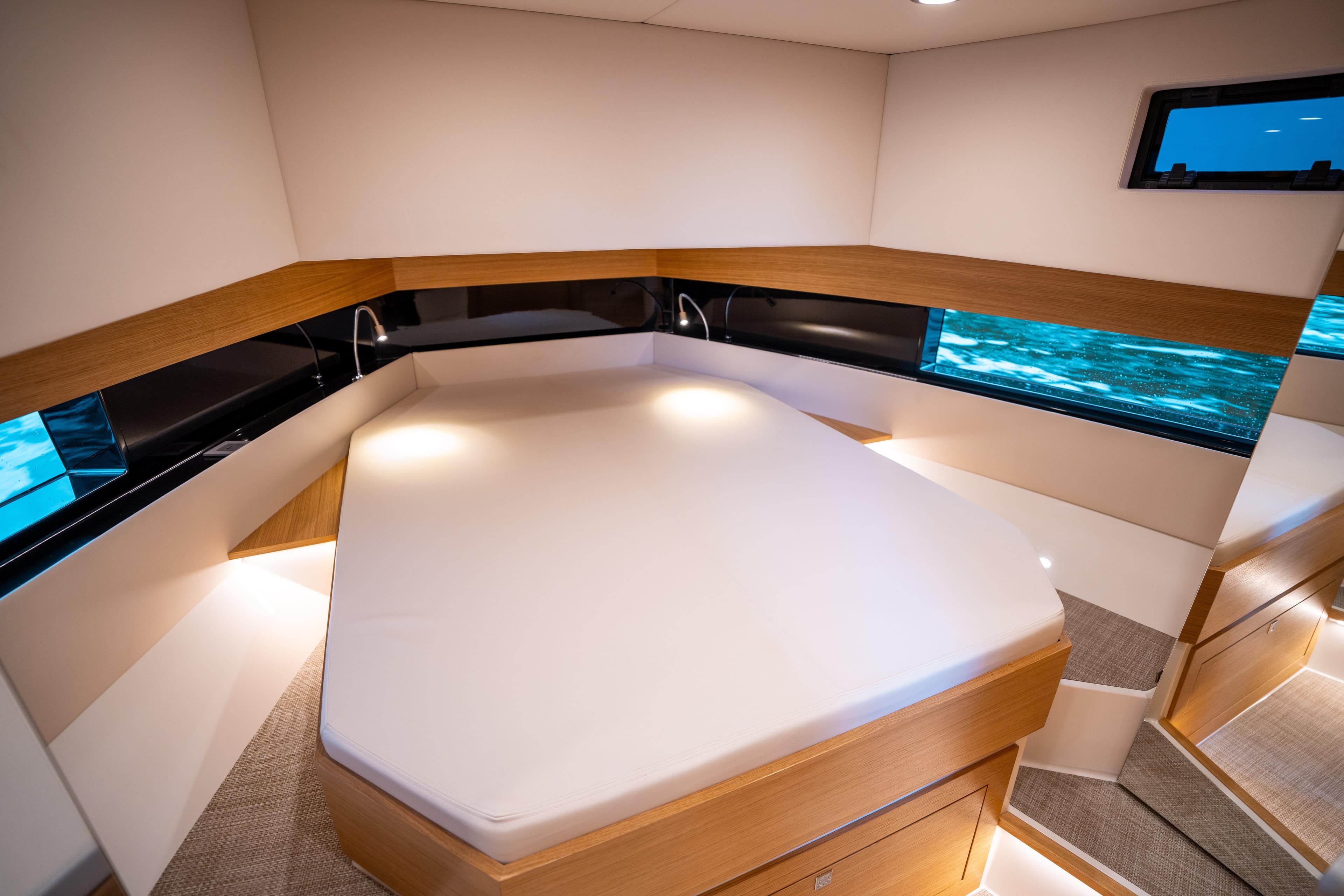 Luxurious cabin interior of 2025 De Antonio Yachts D42 Open, featuring modern design and ambient lighting.