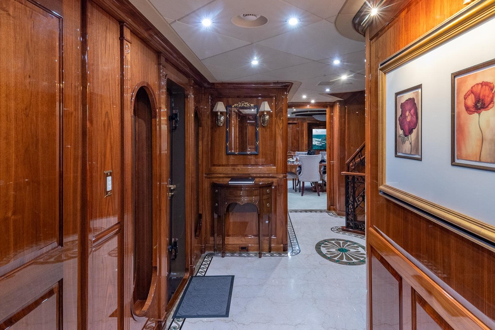 Luxurious interior of 2005 Christensen motor yacht with polished wood and elegant decor.