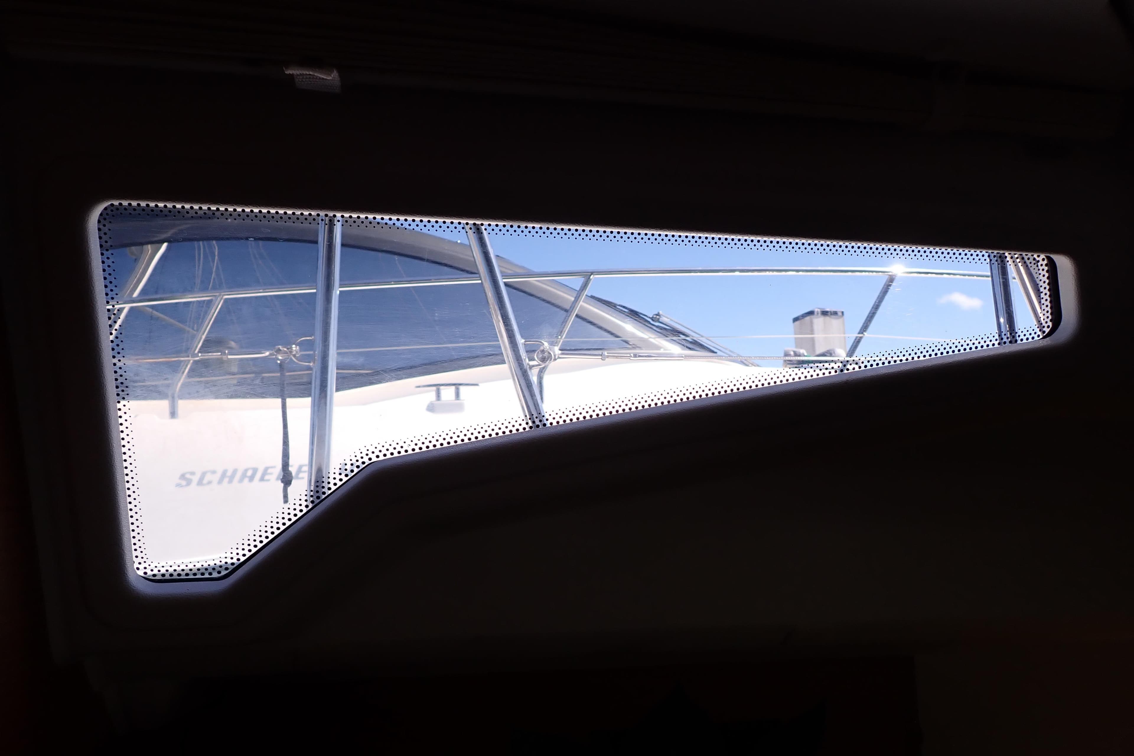 View from Jeanneau Sun Odyssey 389 window, showcasing exterior yacht details, 2018 model.