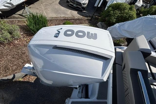 2026 Monterey Elite 25 OB boat engine, top view, outdoors.