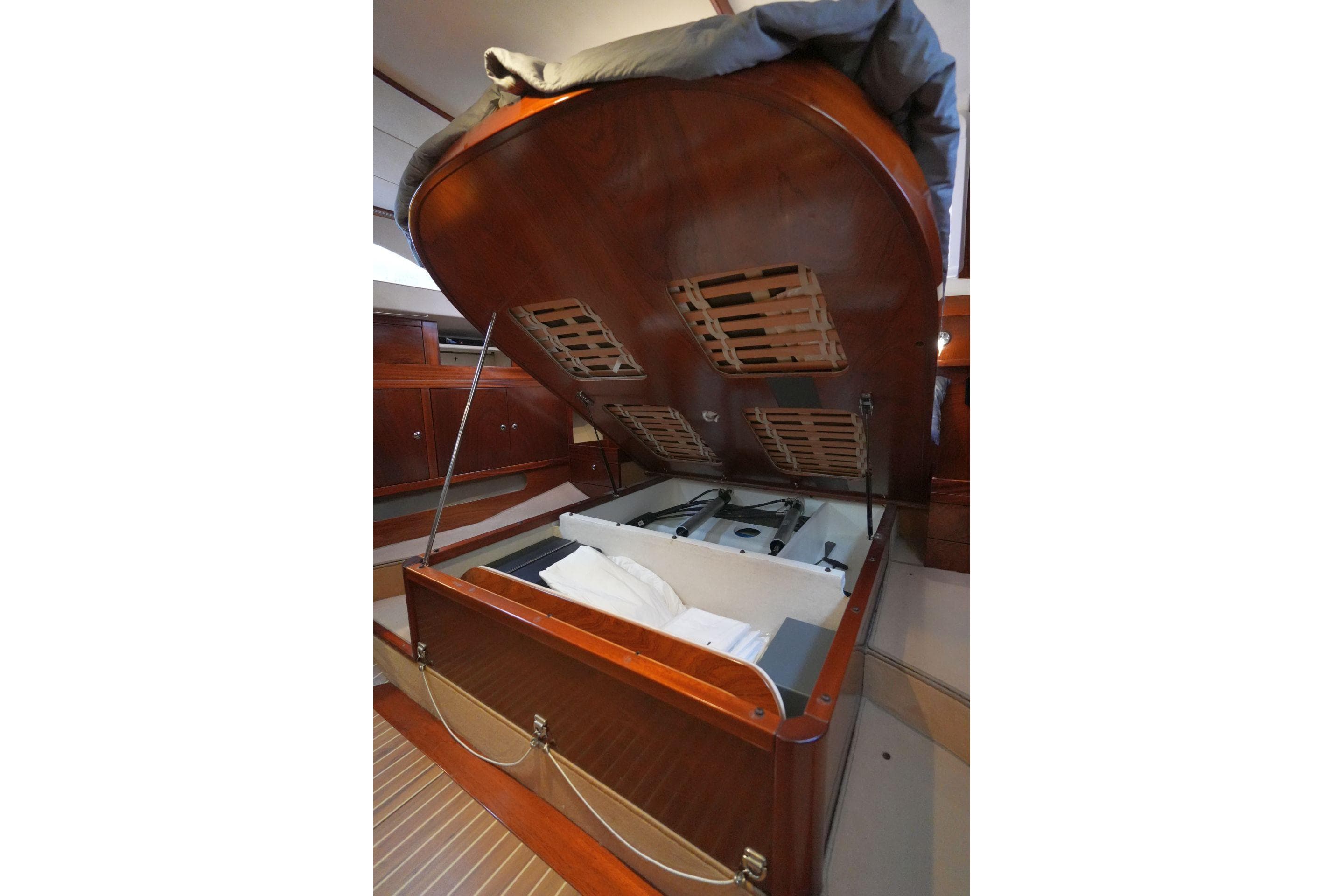 Interior view of 2010 Amel 54 yacht with open storage compartment.