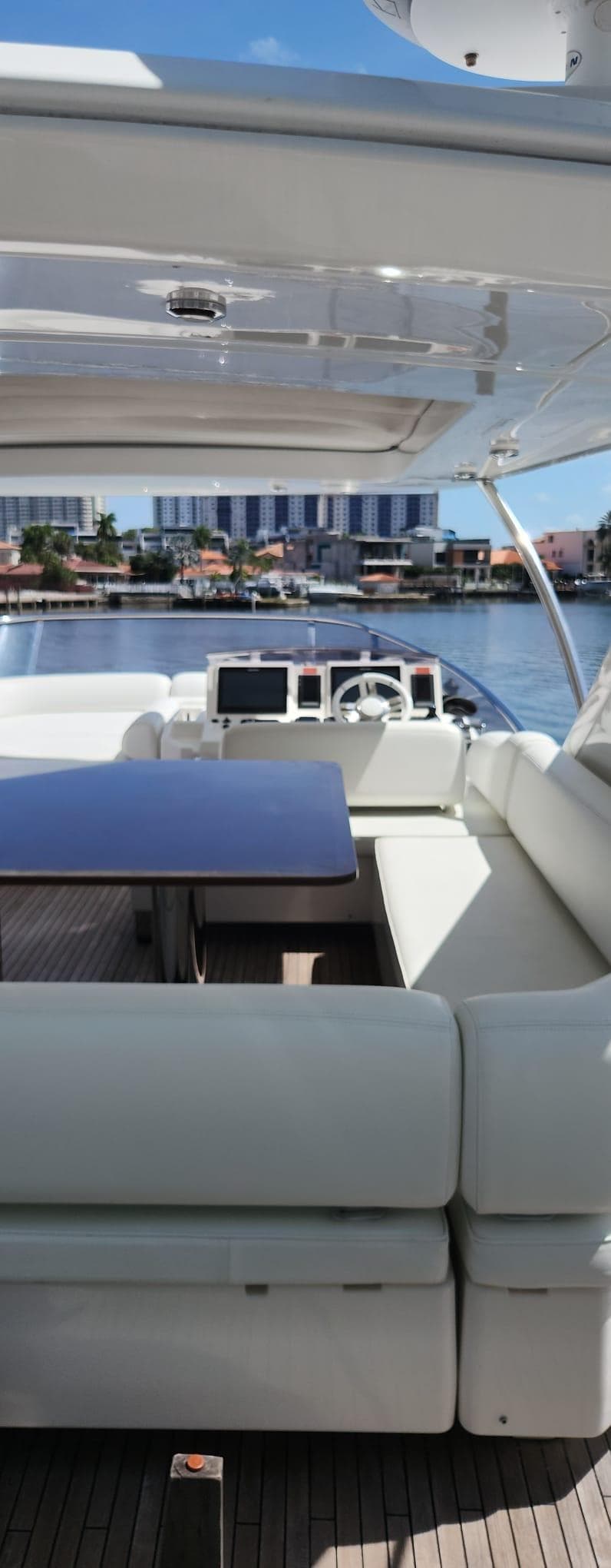 Luxurious 2014 Azimut Flybridge yacht interior with waterfront view.