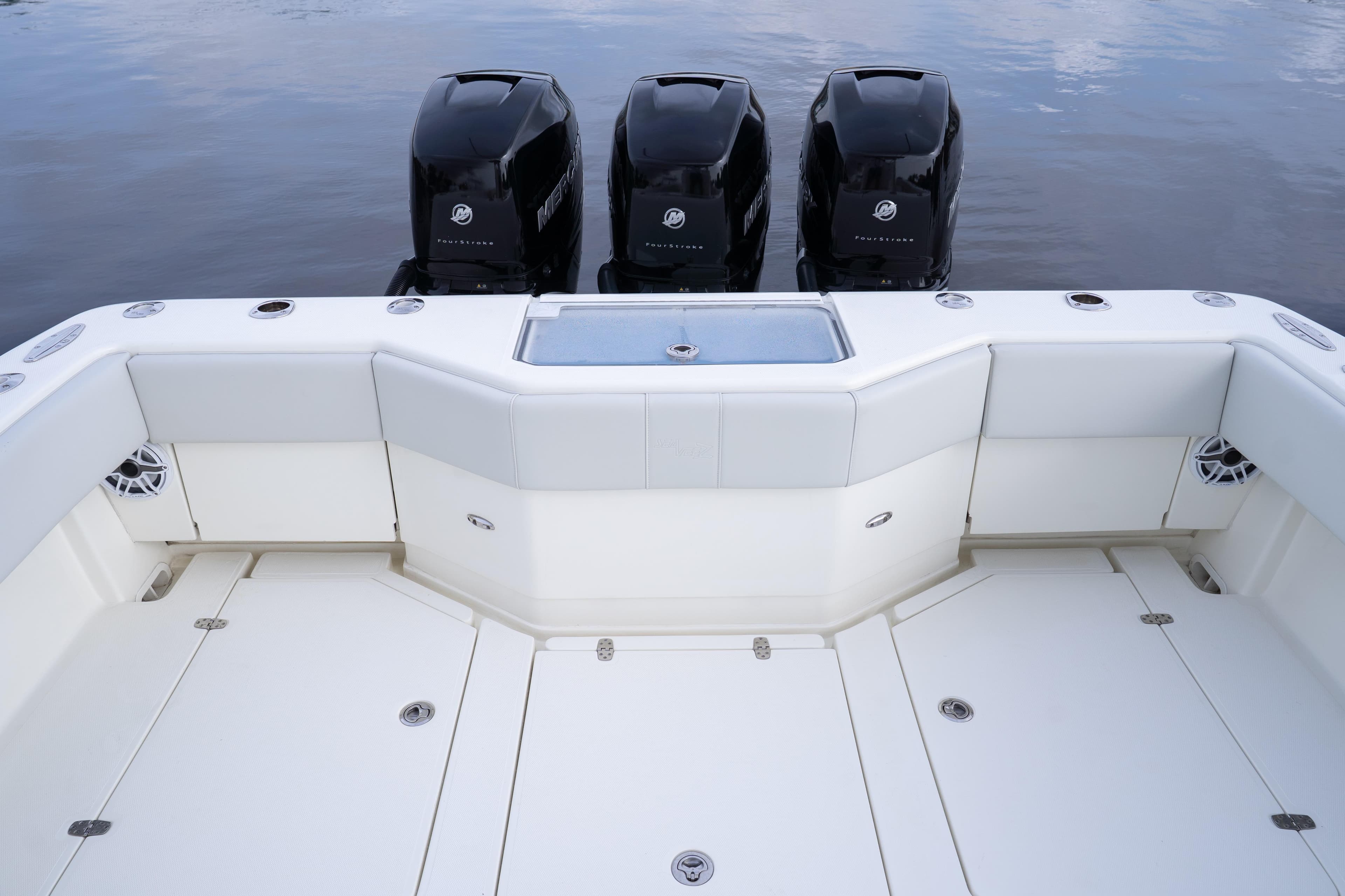 2015 SeaVee 39Z boat with four Mercury outboard engines, spacious deck, and seating area.