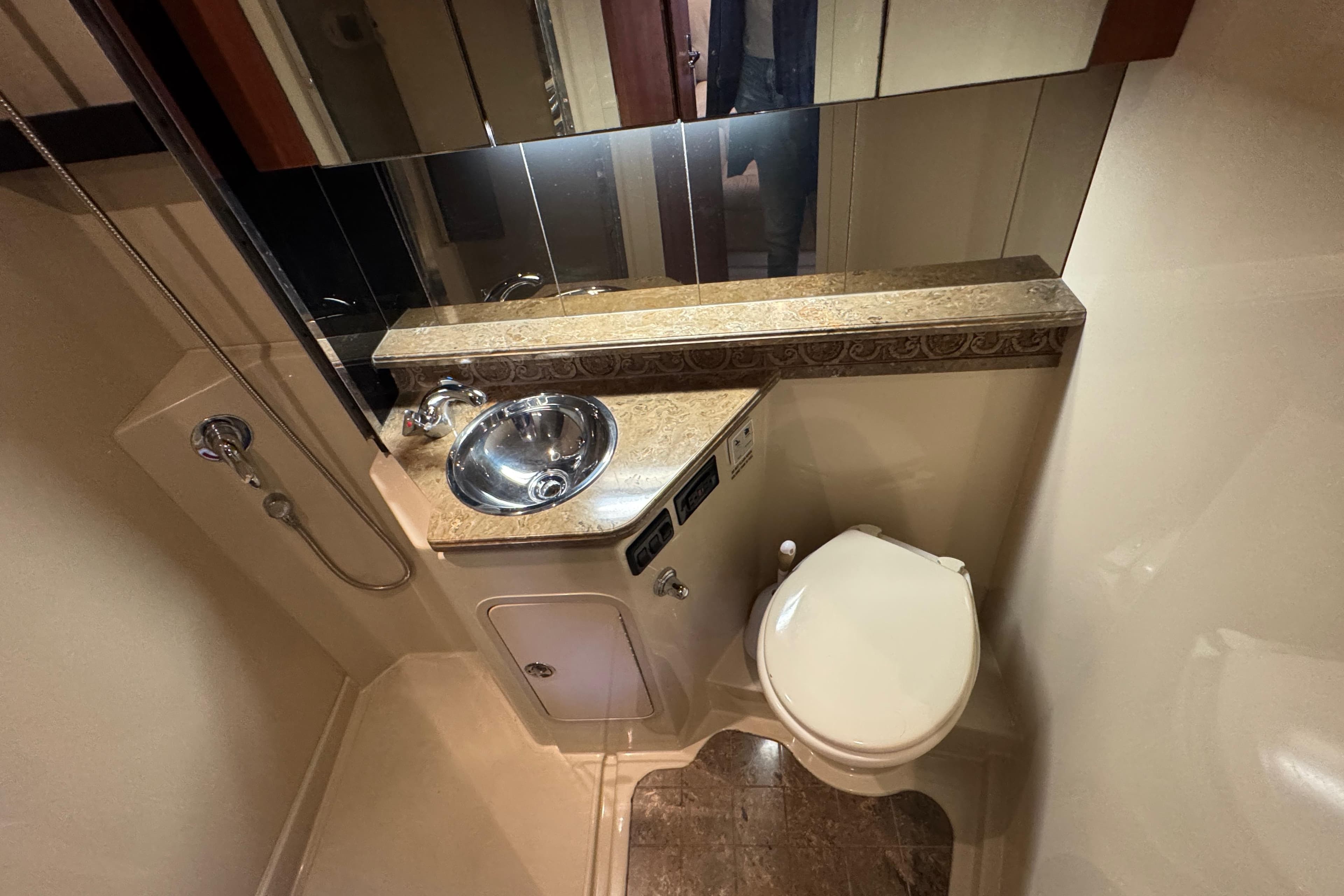 Luxurious 2008 Cruisers Yachts 360 Express bathroom with sink, toilet, and mirror.
