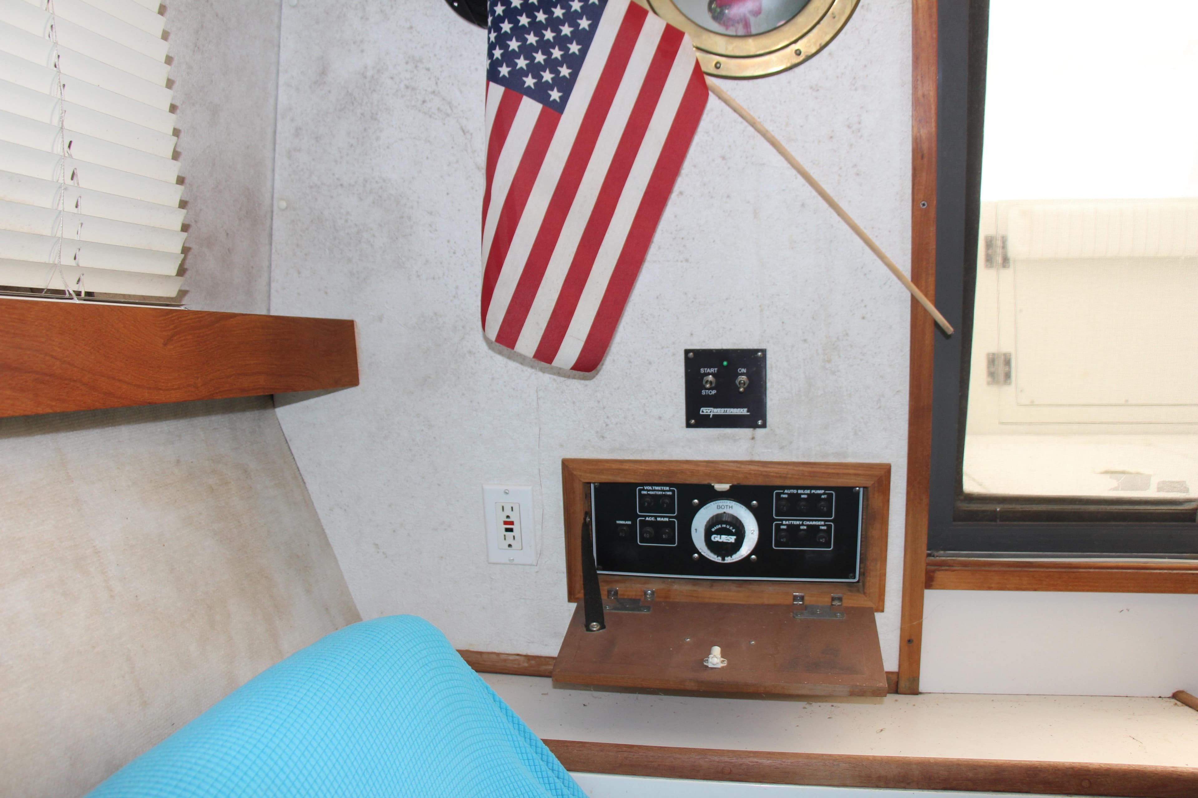 Interior of 1995 Carver 330 Mariner with control panel and American flag.