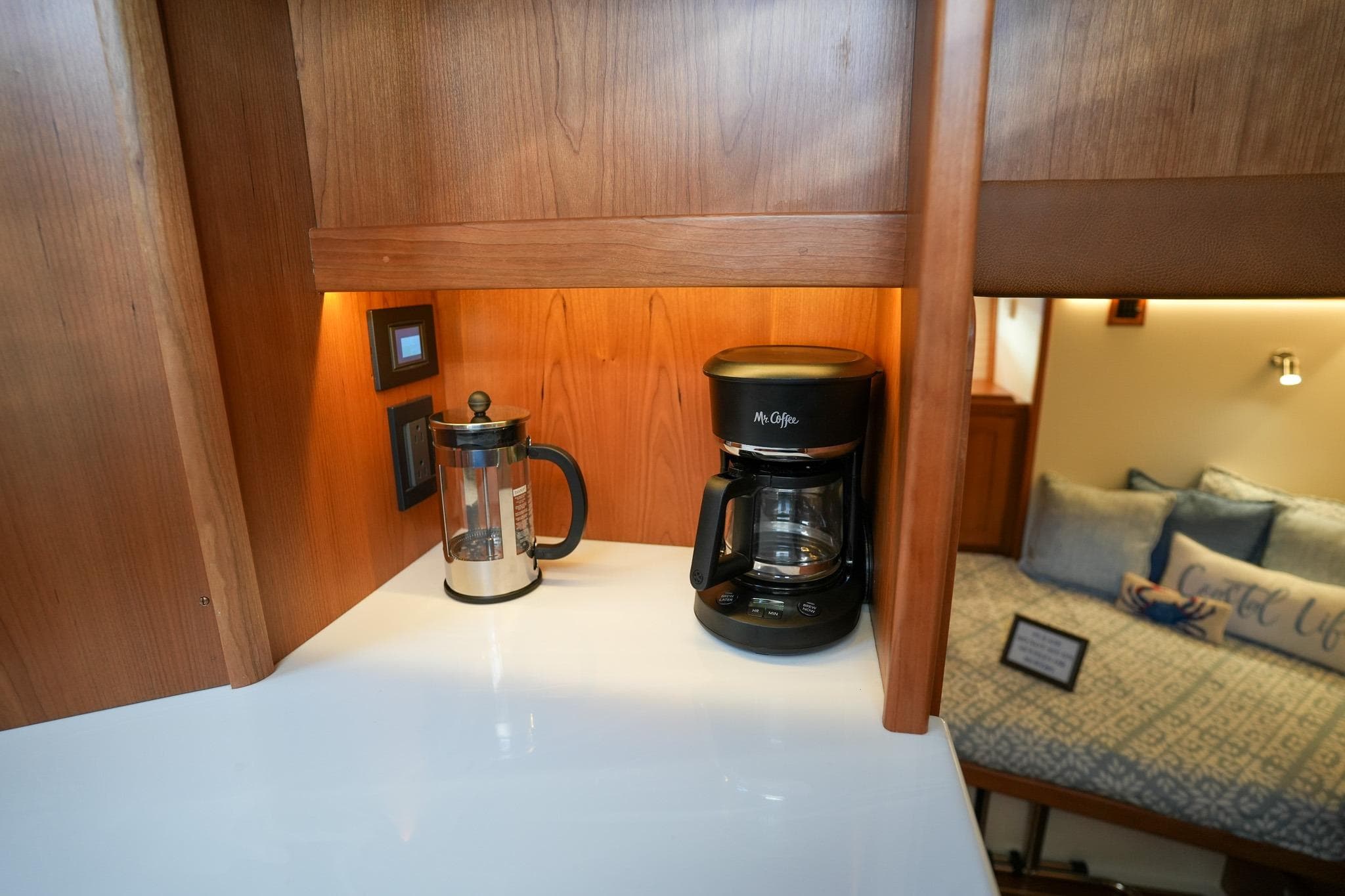 Cozy Sabre 51 Salon Express interior with coffee maker and French press, 2026 model.