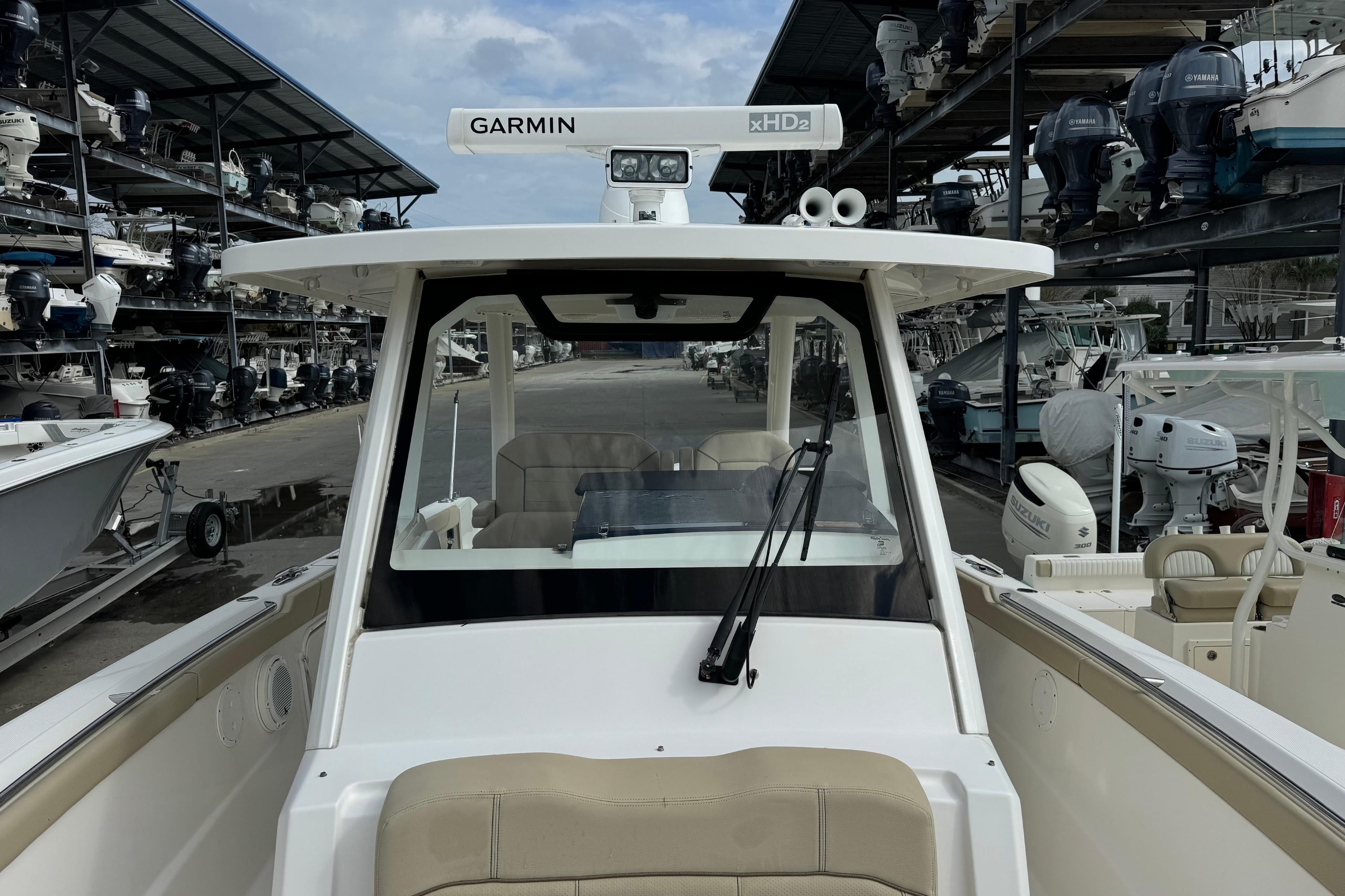 2018 Pursuit S 328 Sport boat with Garmin xHD2 radar in marina storage.