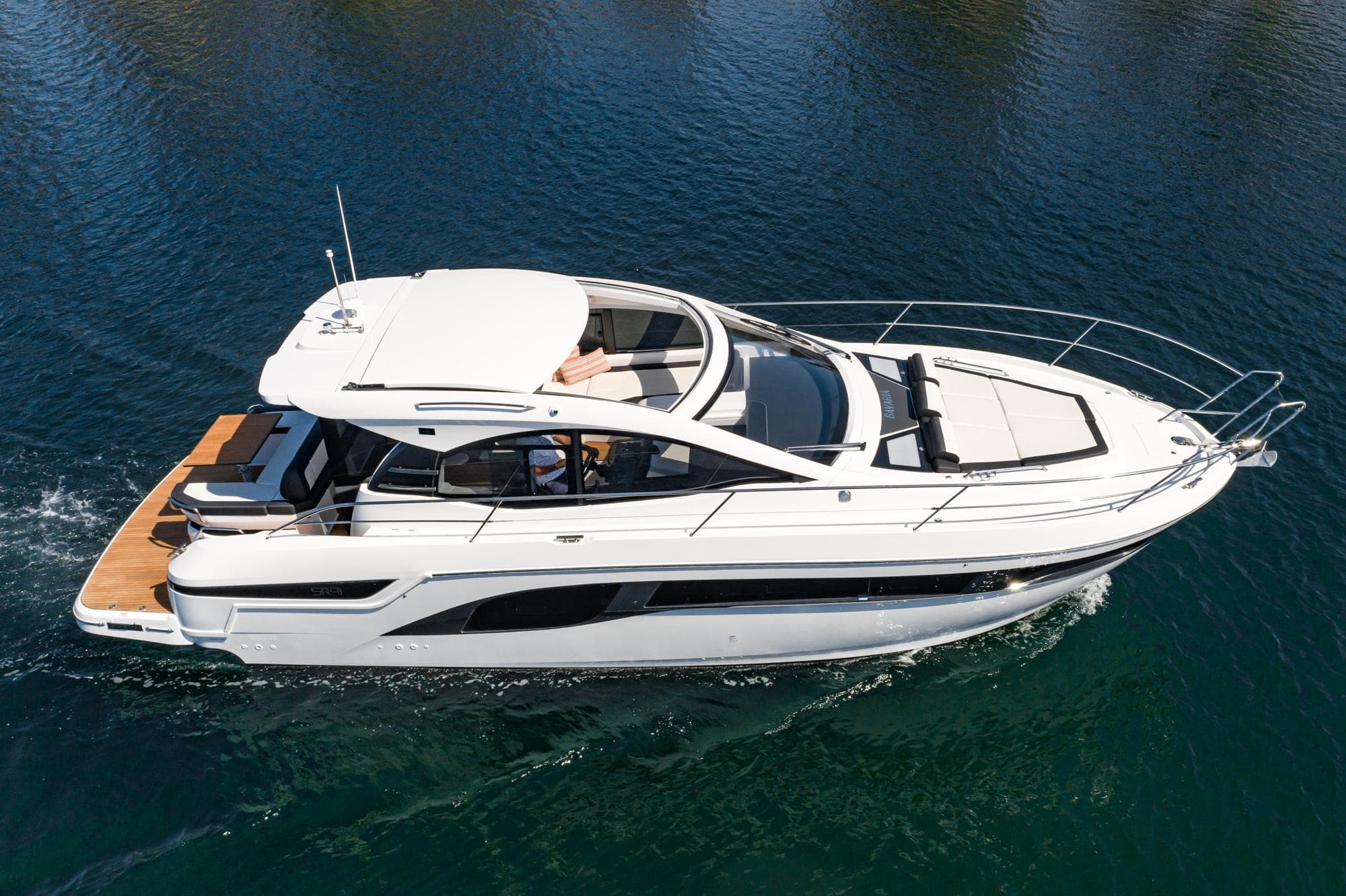2024 Bavaria SR41 yacht cruising on clear blue water, showcasing sleek design and luxury features.