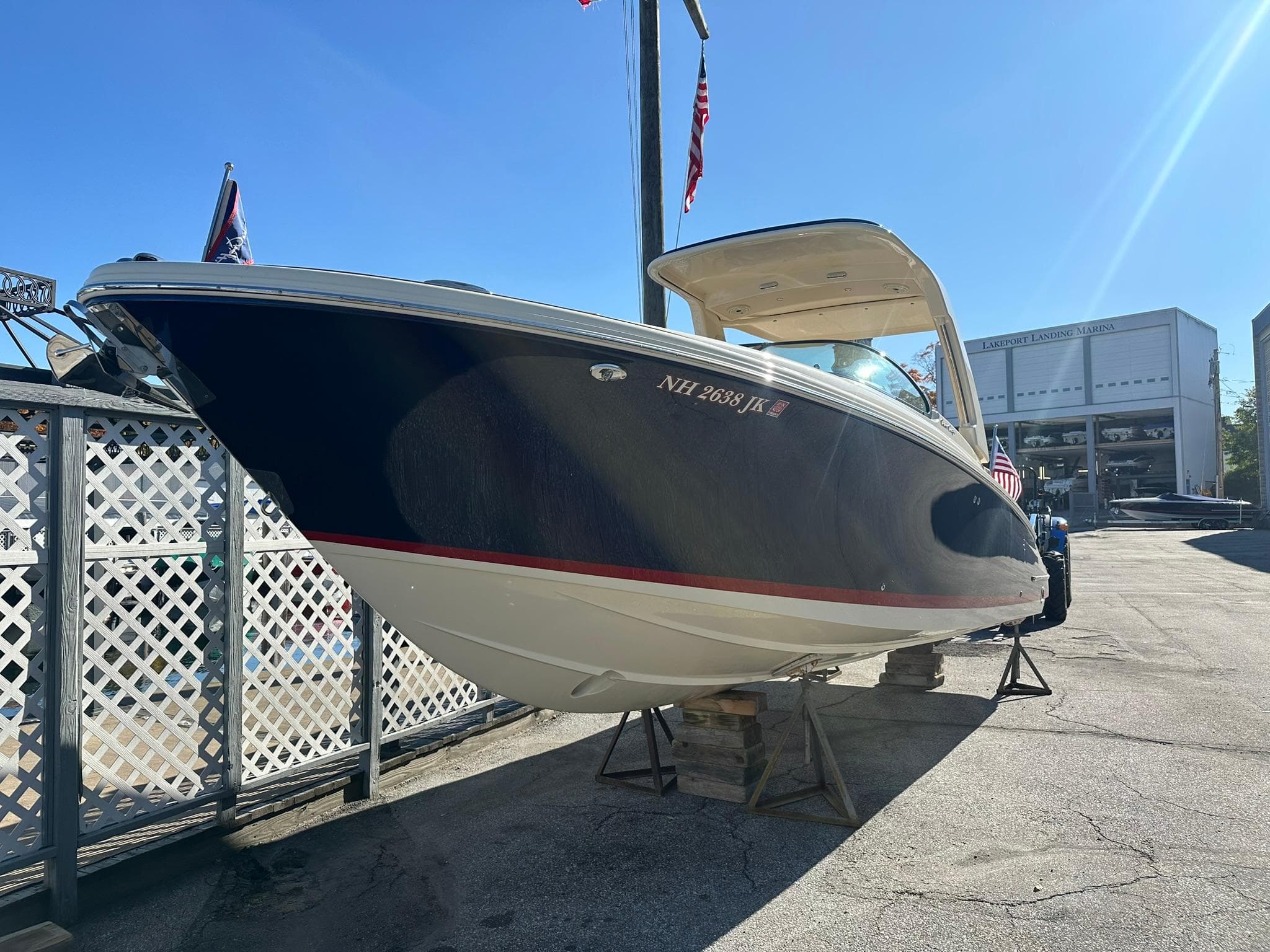 2023 Chris-Craft Launch 28 GT boat on display in a marina setting.