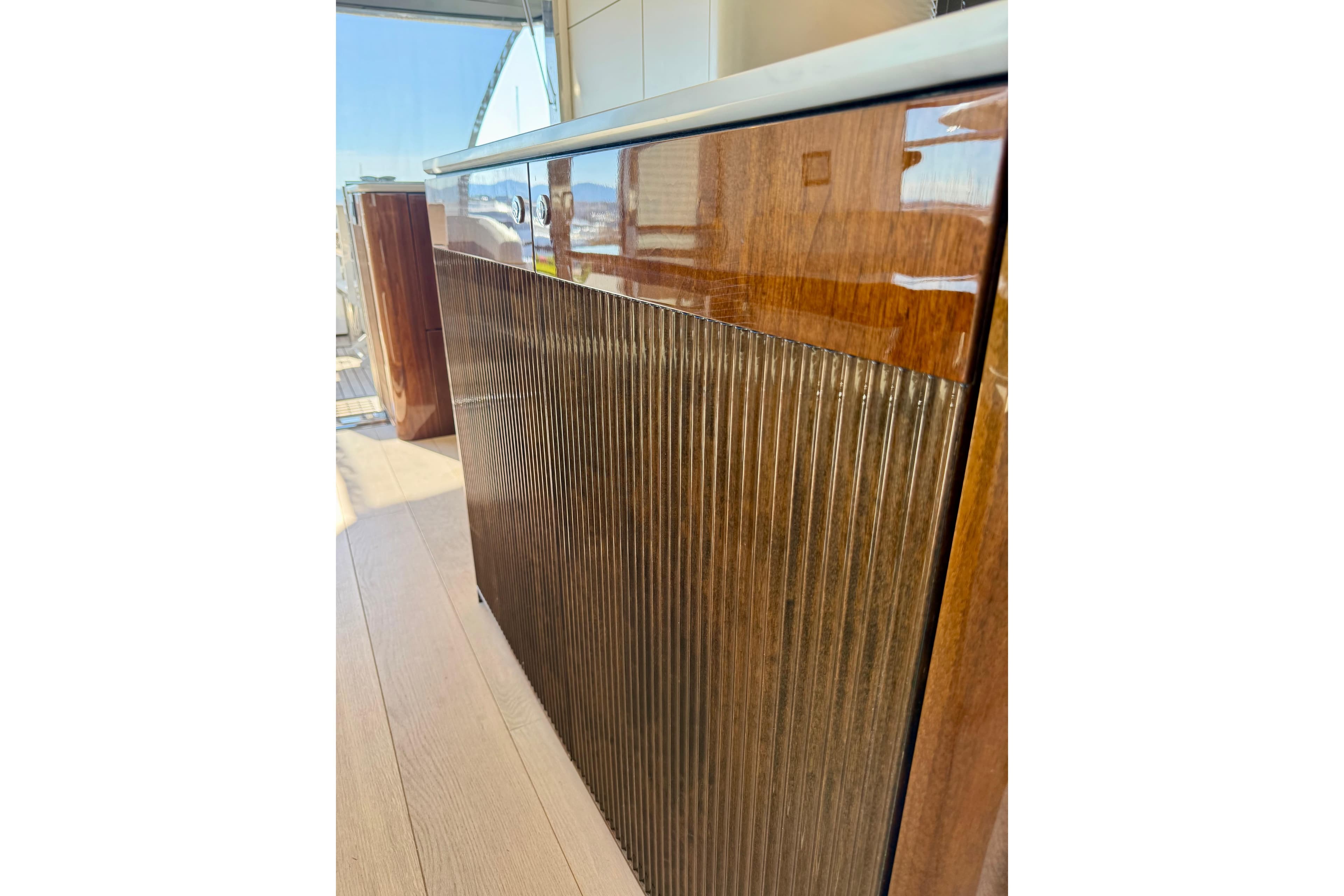 Luxurious interior detail of 2022 Fairline Squadron 68 yacht with polished wood finish.