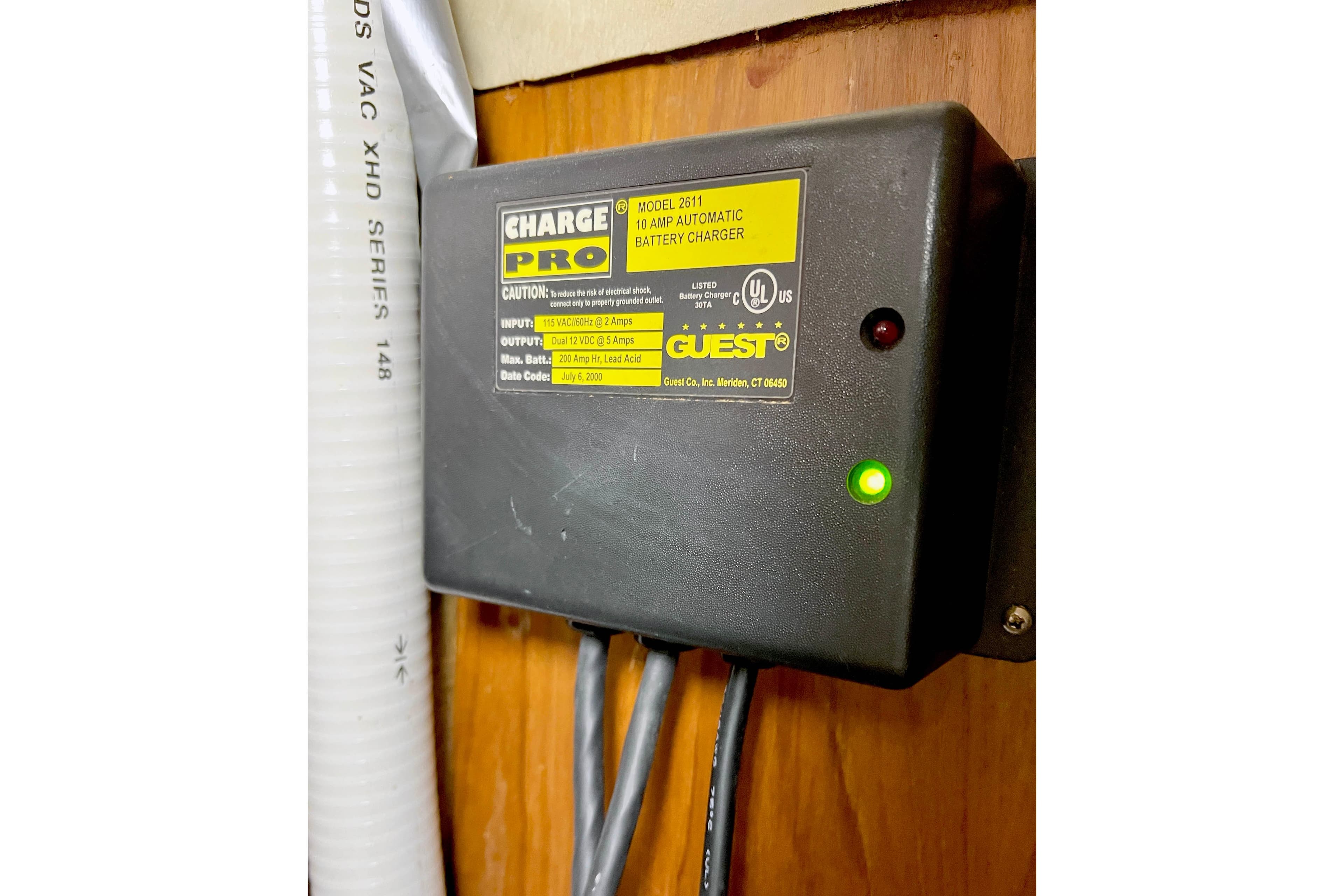 Battery charger installed on 1981 Beneteau First 32 sailboat, with green indicator light.