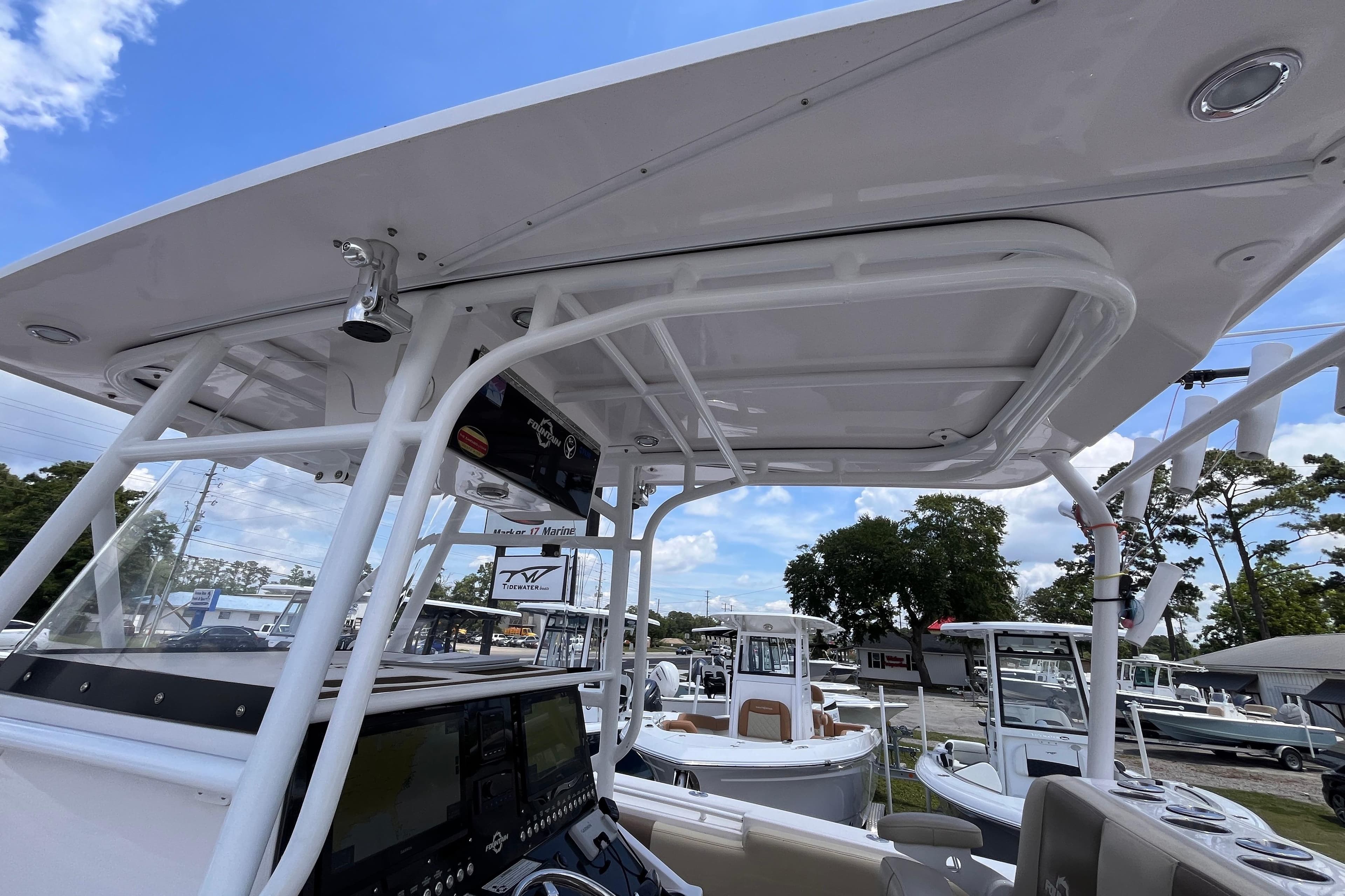 2019 Fountain 38 Center Console boat interior with T-top and control panel.