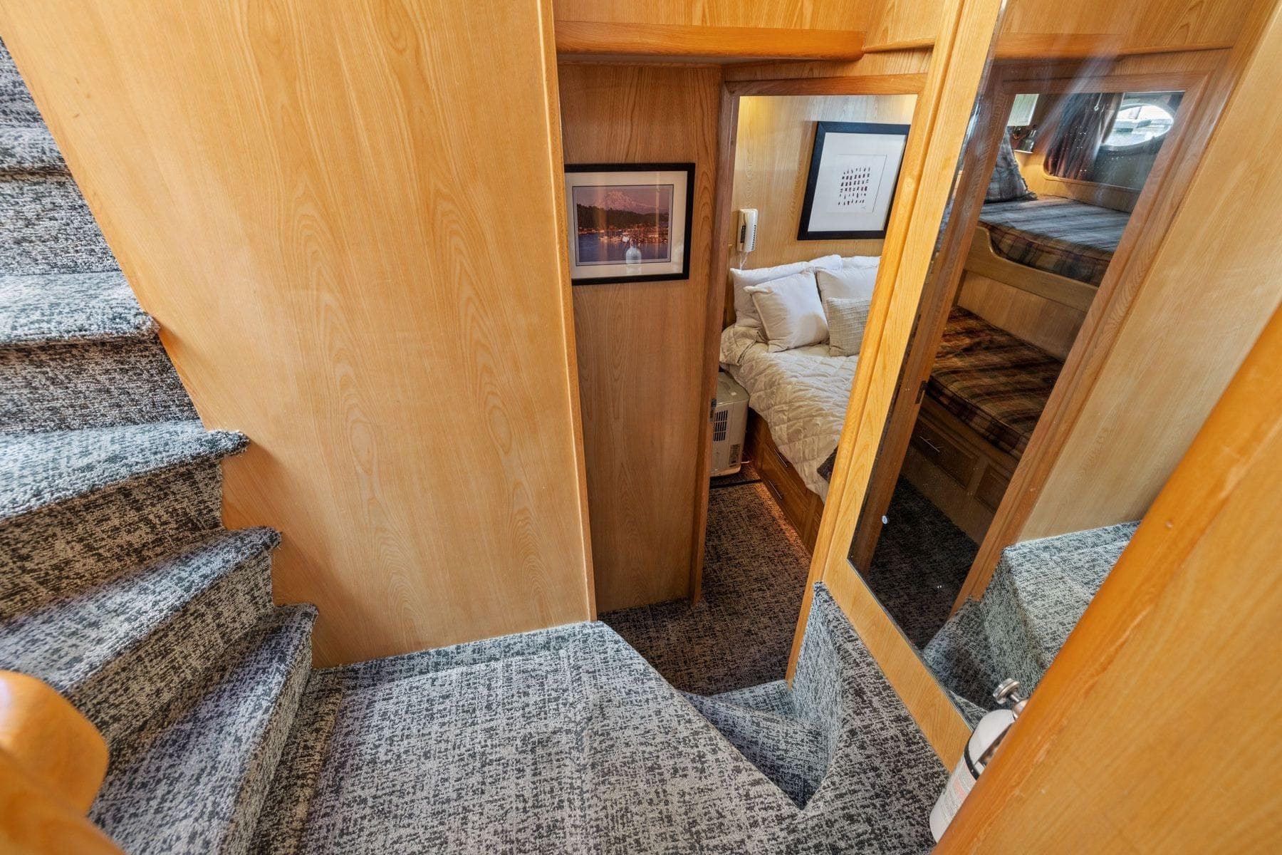 Interior of 1991 Ocean Alexander 520 Pilothouse with carpeted stairs and cozy cabin.