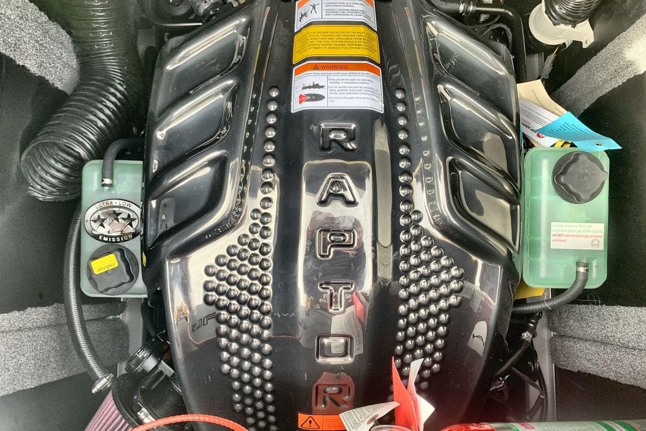 Engine of 2026 Supra SE 550 with "Raptor" branding and ultra-low emission label.