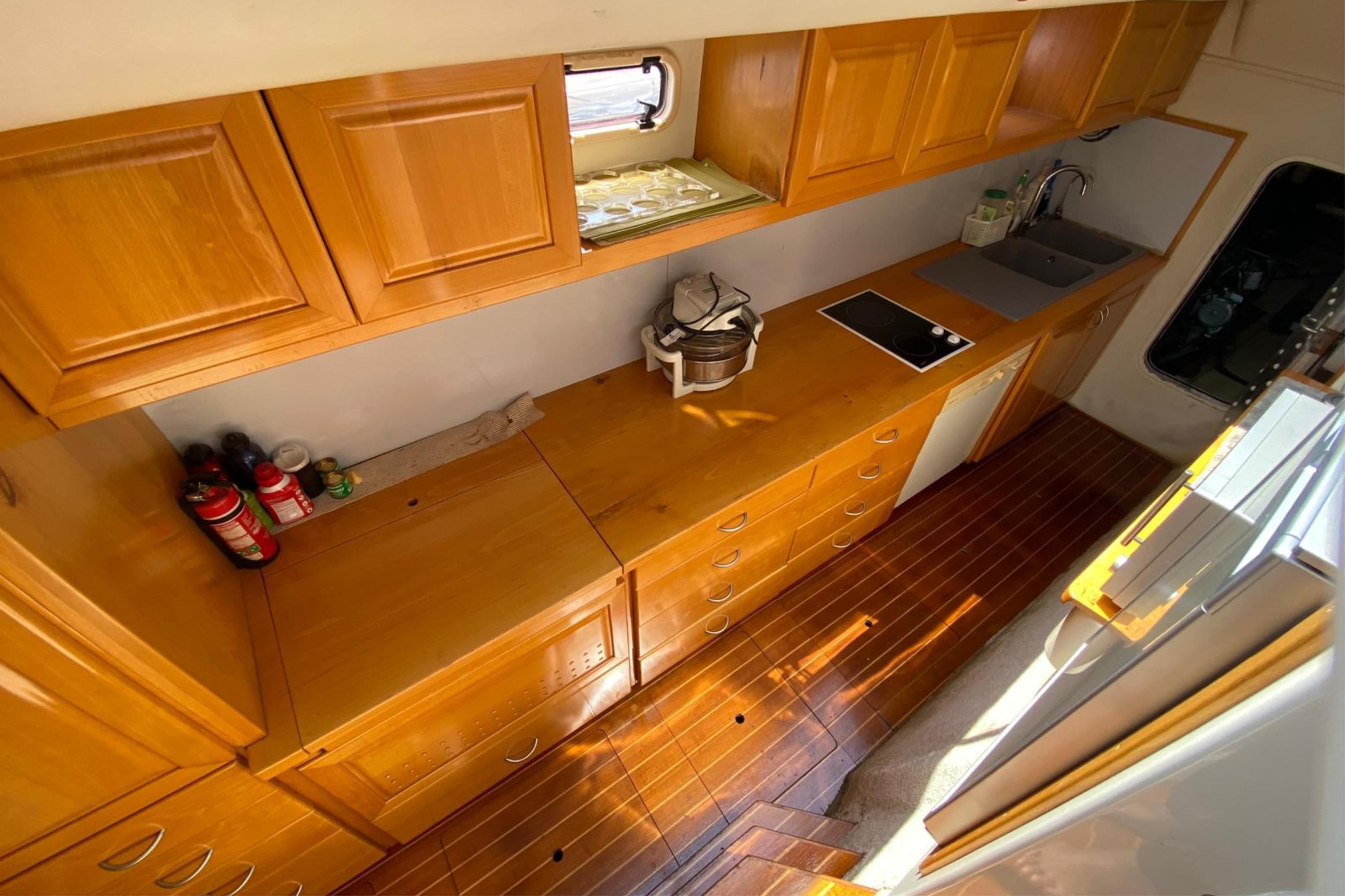 Luxurious wooden kitchen interior of 2007 Sun Yachts Custom 56 Power Cat.