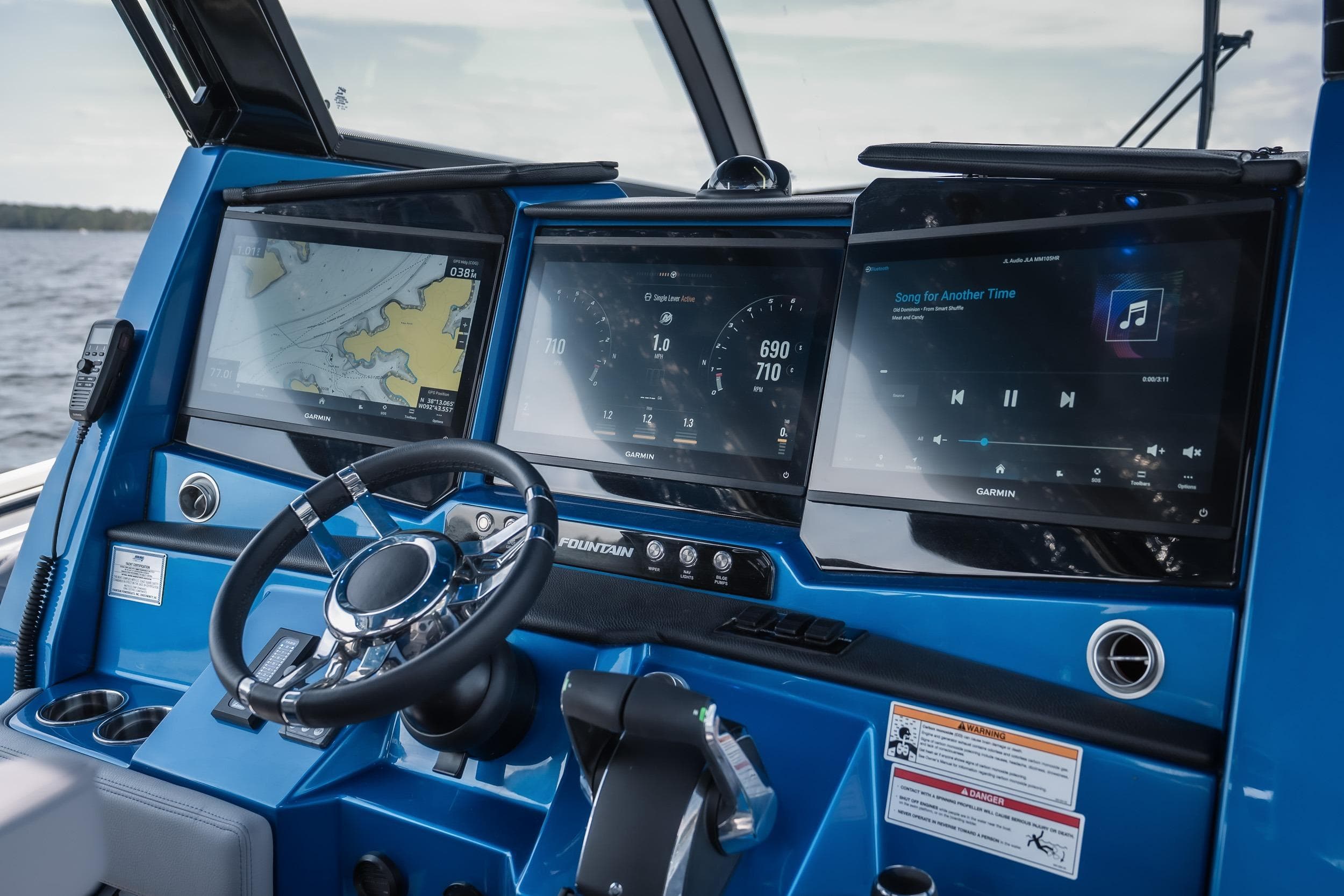 Dashboard of 2026 Fountain 43 SCX boat with navigation and entertainment screens.