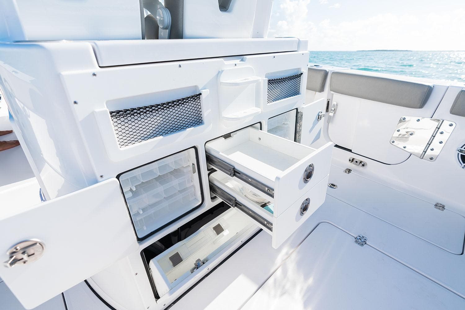 Manufacturer Provided Image: 2025 Sportsman Open 282 Center Console boat interior with storage compartments open.