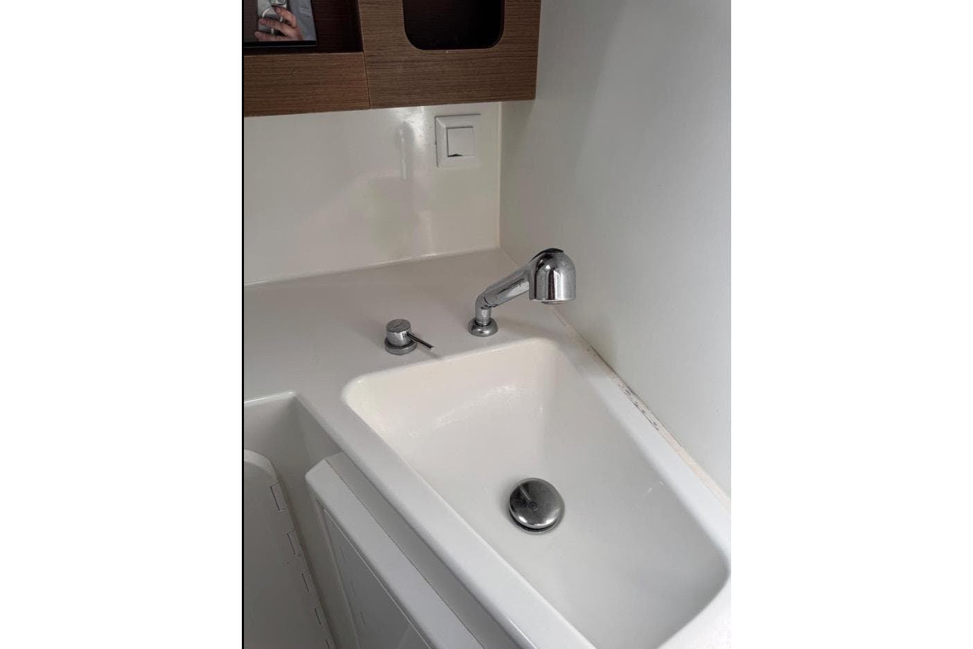 Modern sink in 2018 Lagoon 42 yacht bathroom, featuring sleek faucet and minimalist design.
