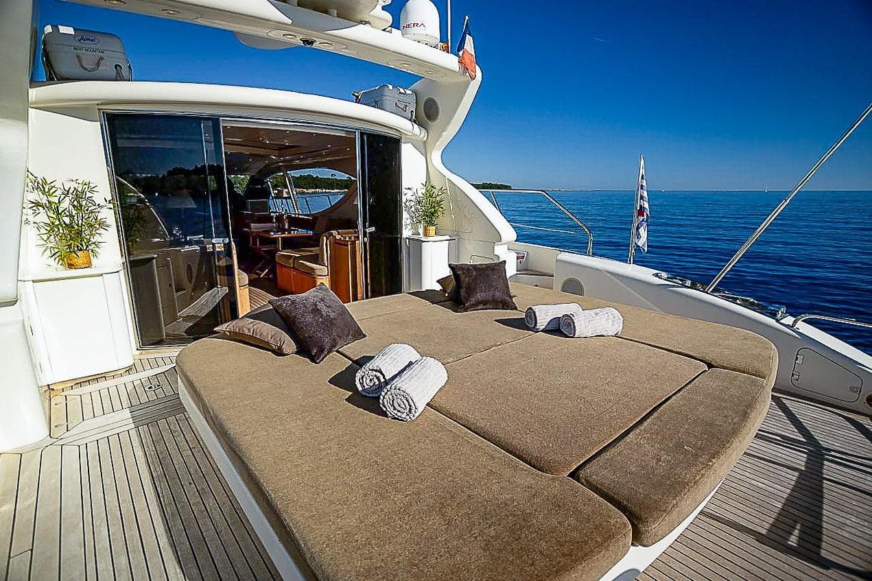 Luxurious 2005 Arno Leopard 24 yacht deck with sun loungers and ocean view.