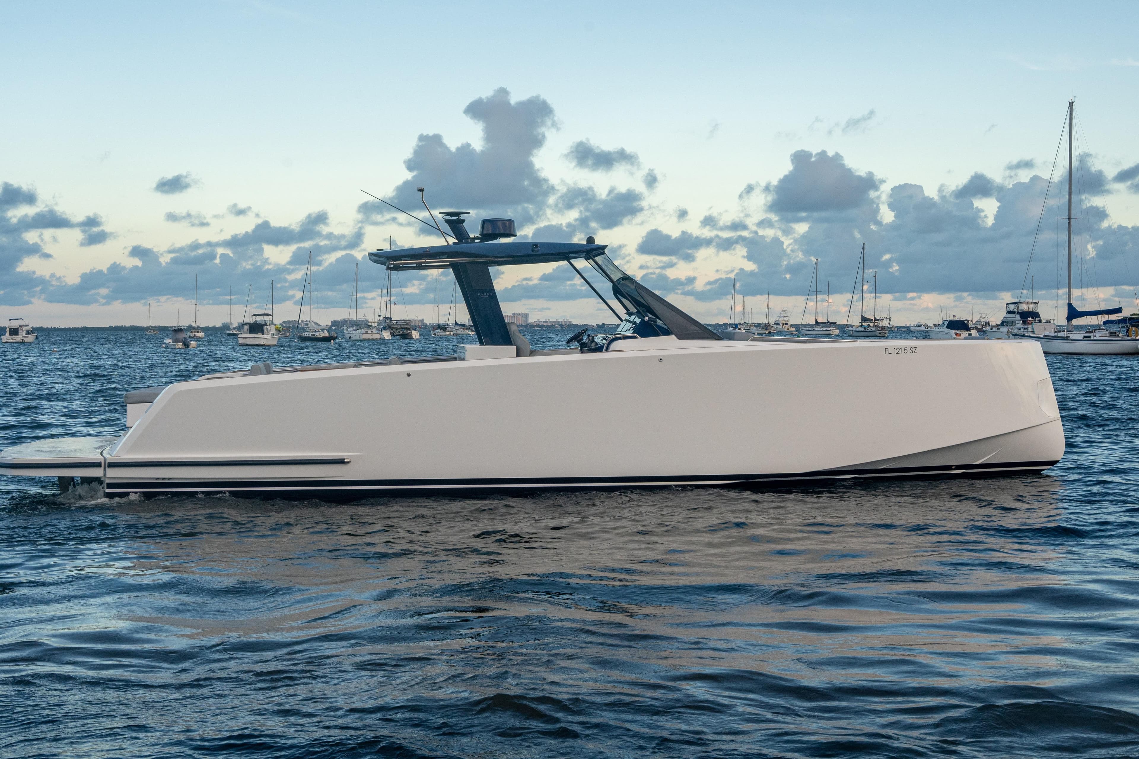 2021 Pardo Yachts 43 on calm water, with a cloudy sky backdrop.