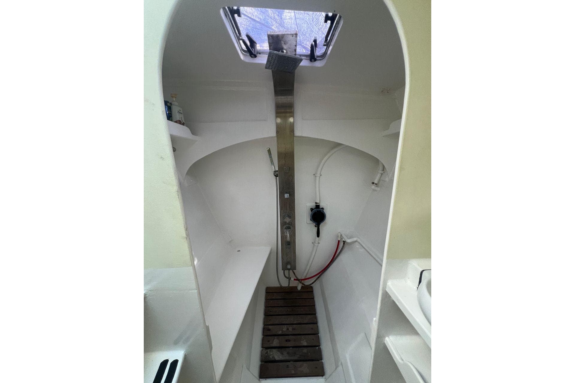 Interior of 2016 Wharram Tiki 46 sailboat, featuring a compact, functional shower area.