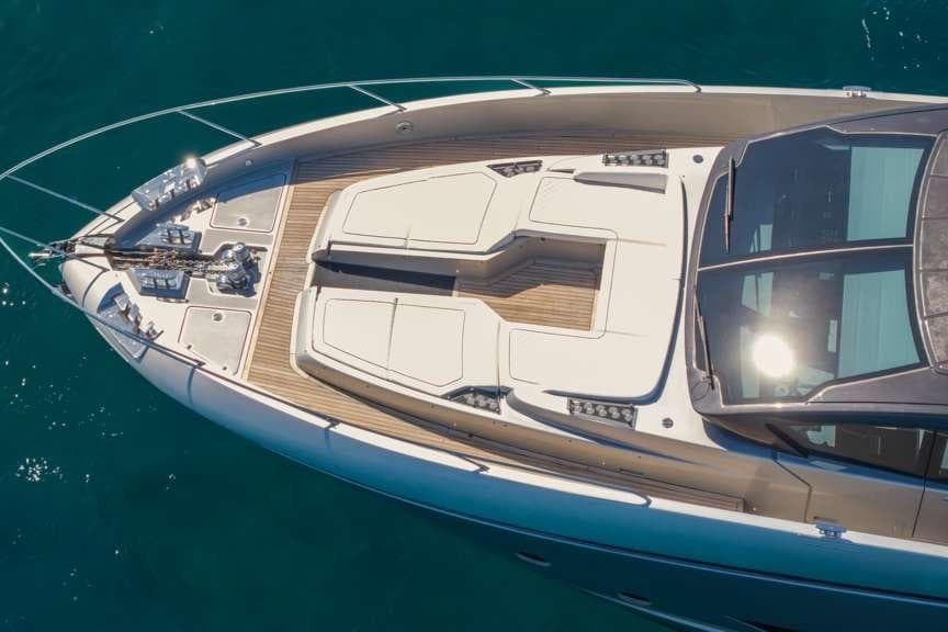 Aerial view of 2026 Riva 82' Diva yacht's sleek deck design on blue water.