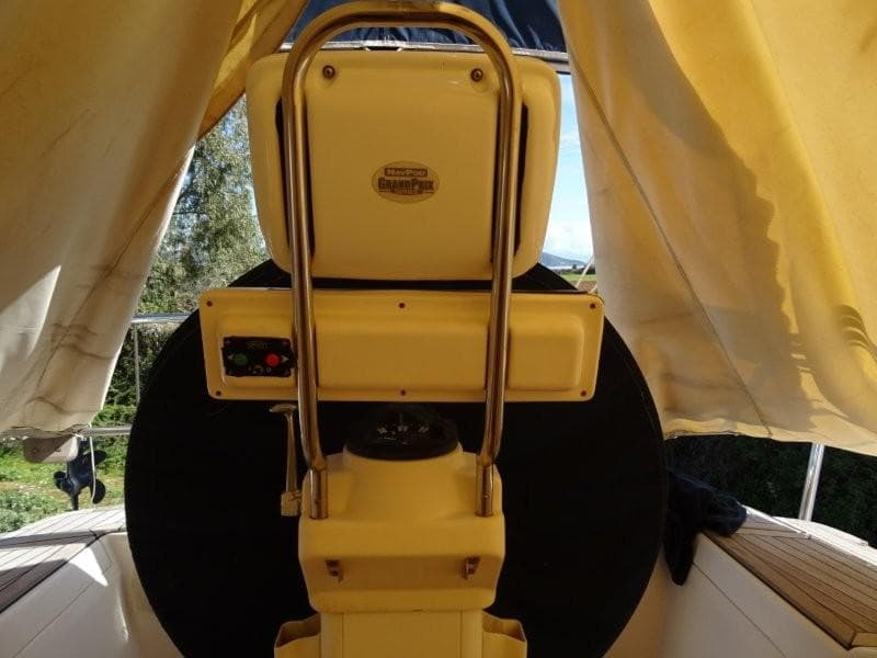 Cockpit of 2000 Wauquiez 43 Pilot Saloon sailboat with steering wheel and controls.