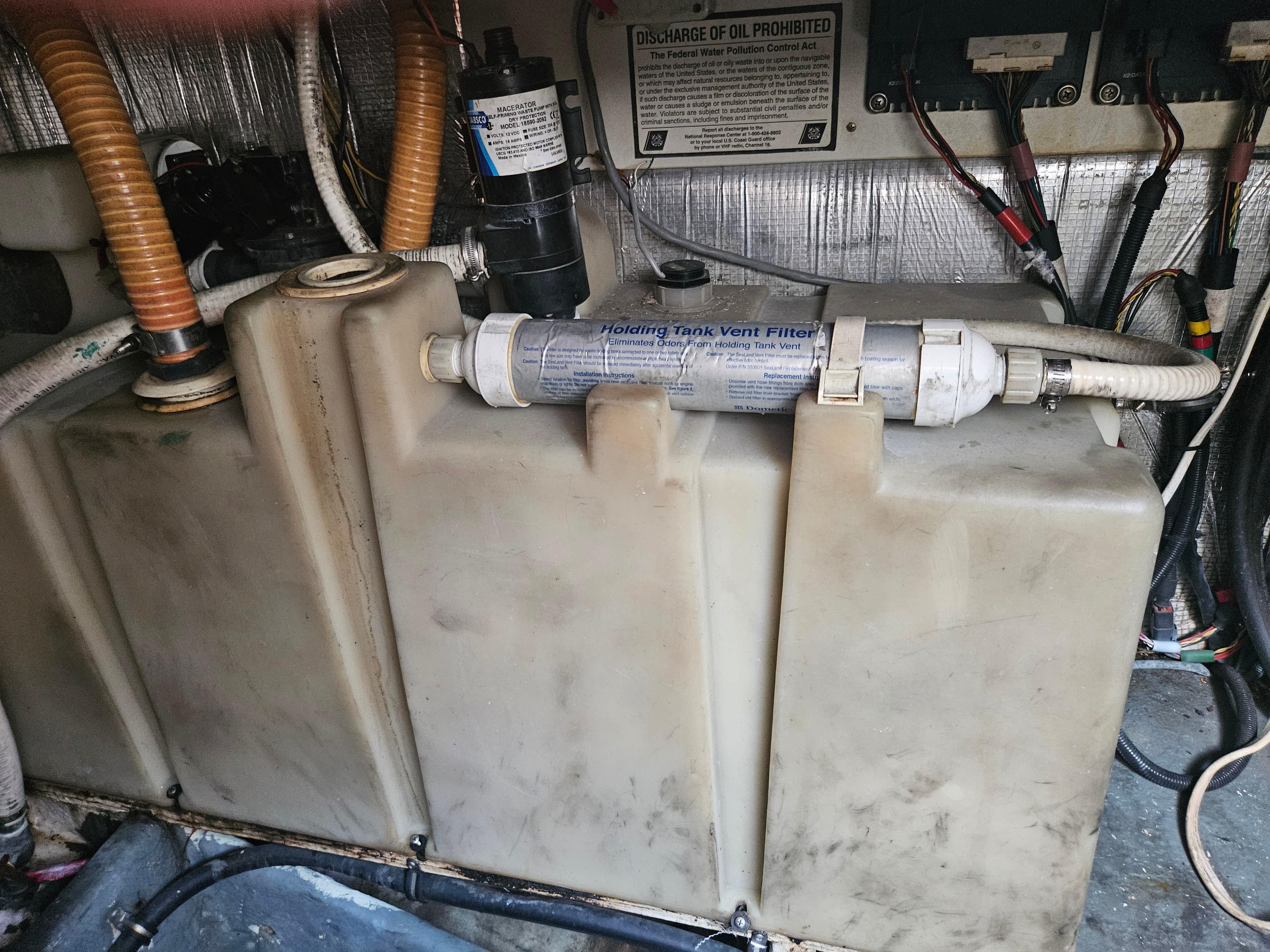 Engine compartment of 2005 Four Winns 378 Vista boat showing fuel tank and vent filter.