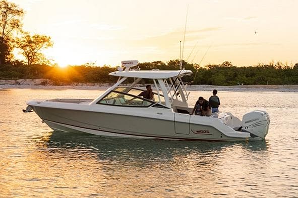 Manufacturer Provided Image: 2026 Boston Whaler 280 Vantage boat cruising at sunset on calm waters.