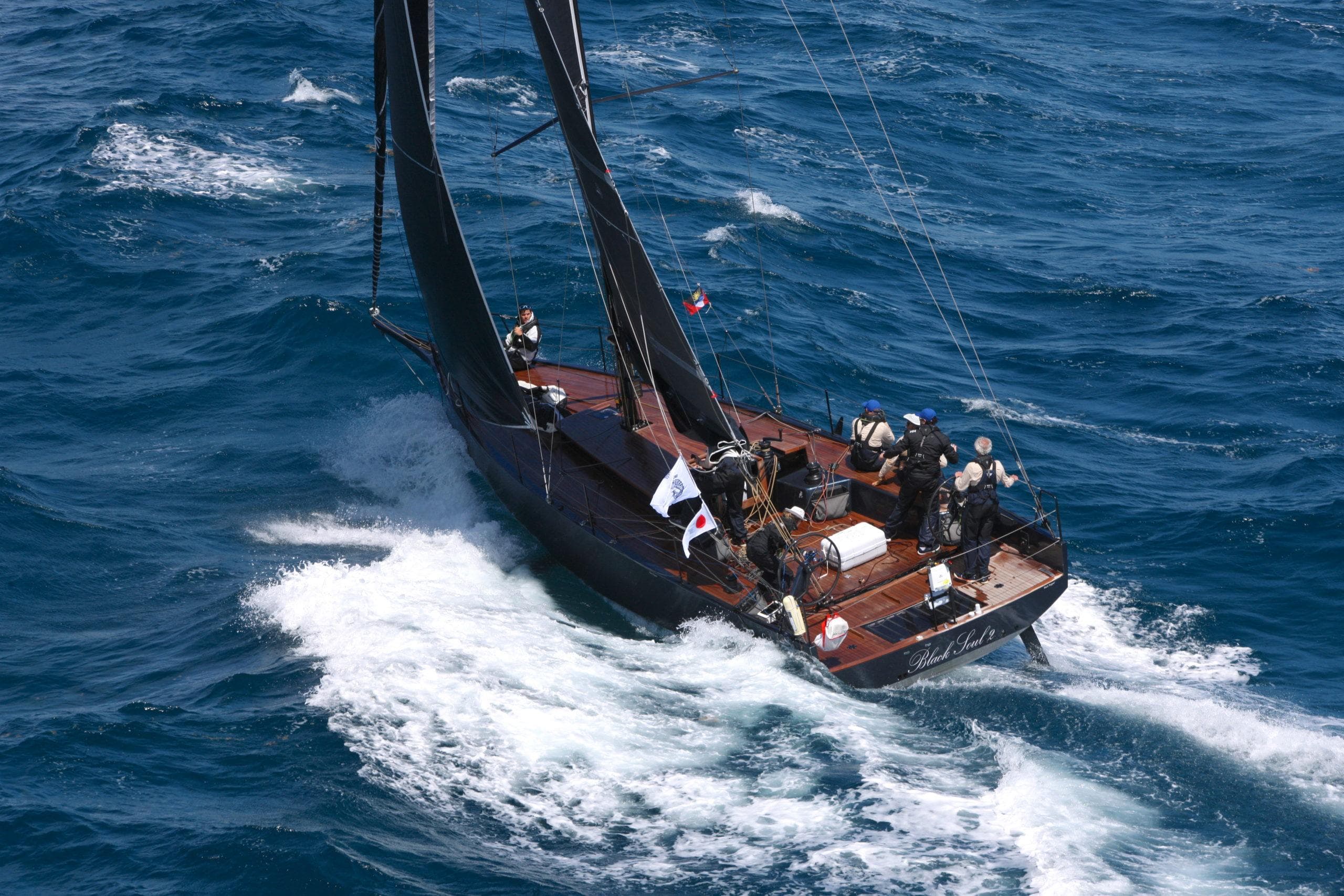 Sailing yacht Black Pepper CODE 1 navigating ocean waves, 2025 model.