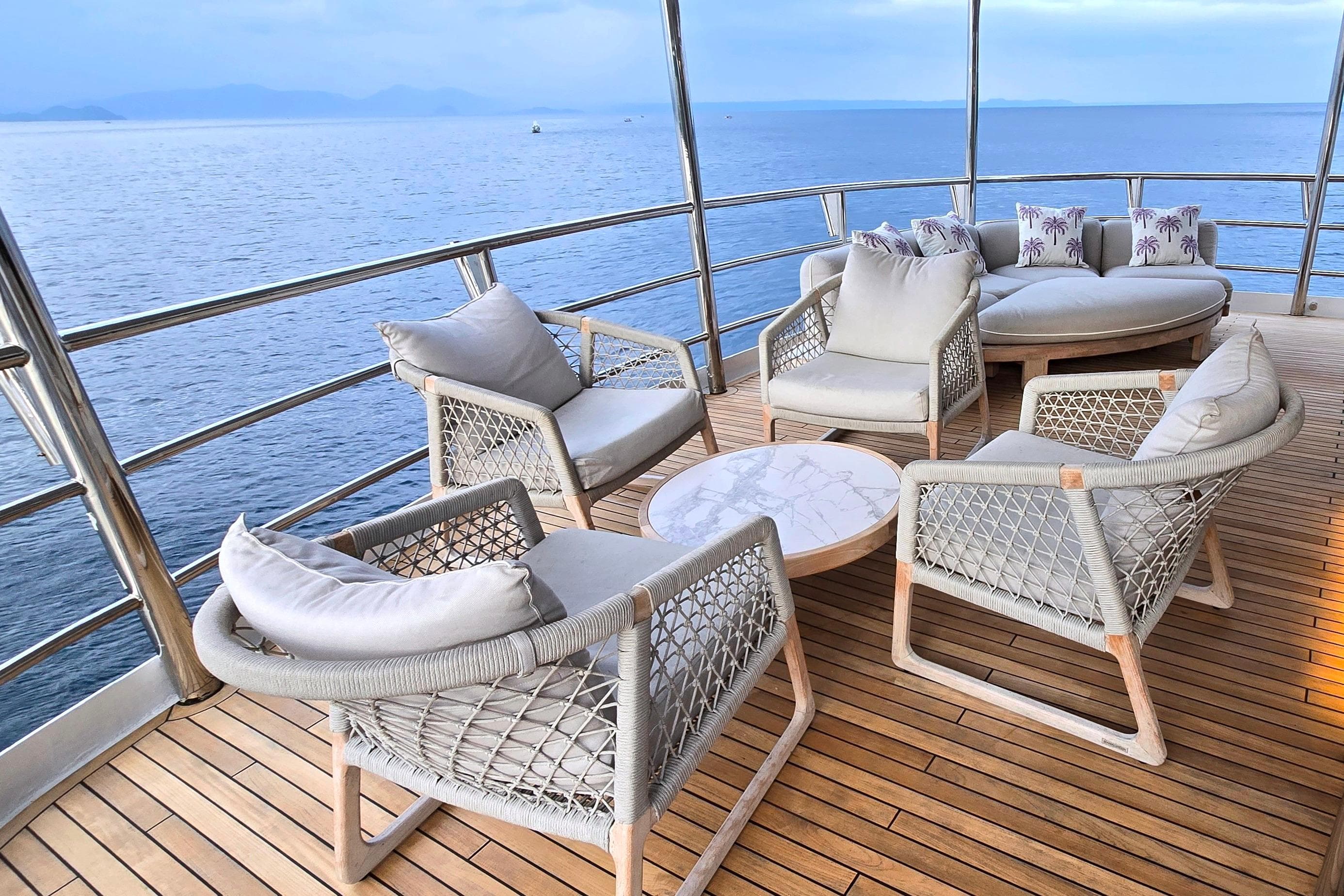 Luxurious yacht deck with elegant seating, ocean view; Halter Marine 98, 1998 model.