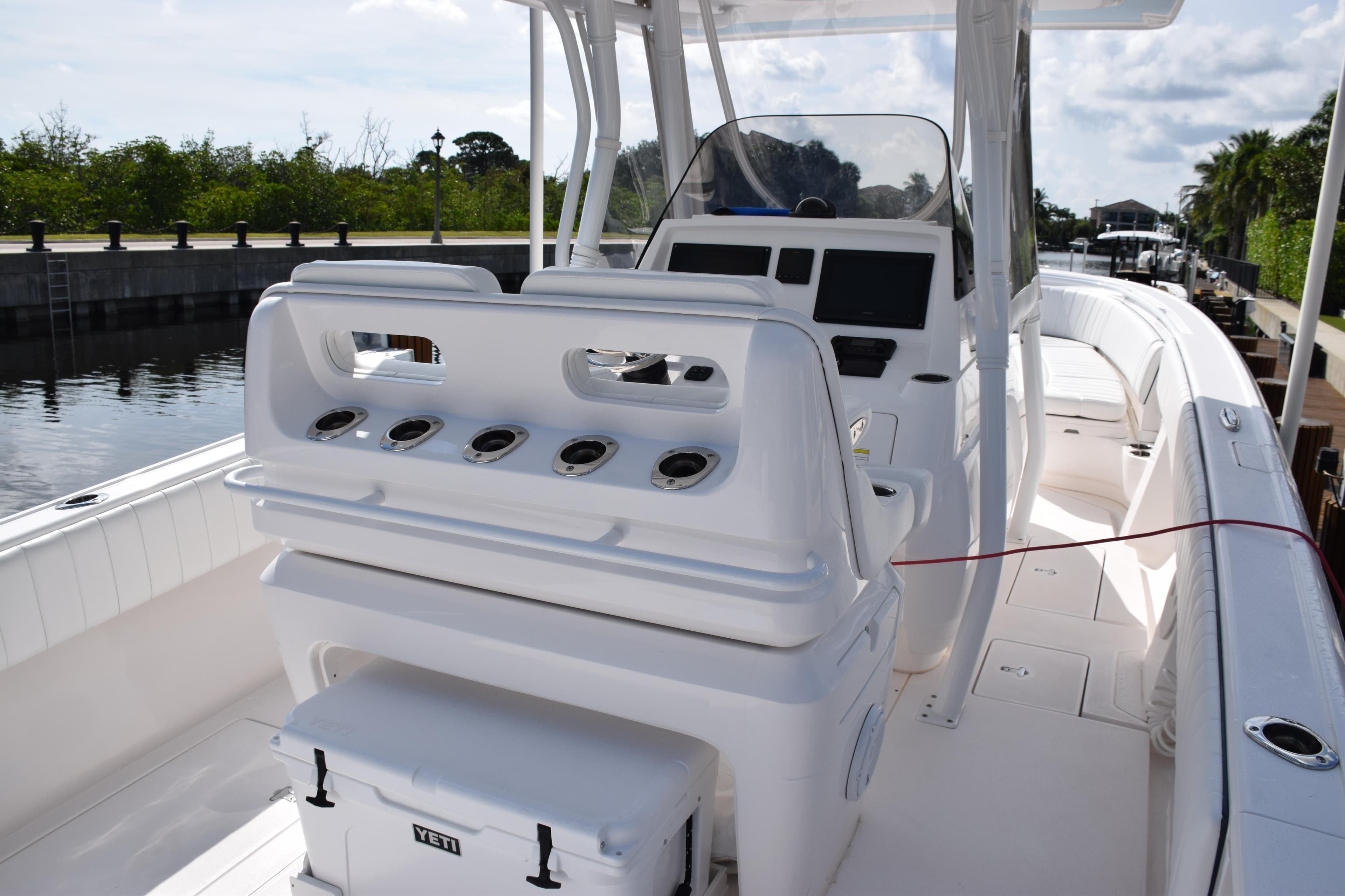 2017 Intrepid 327 boat interior with helm and seating area.