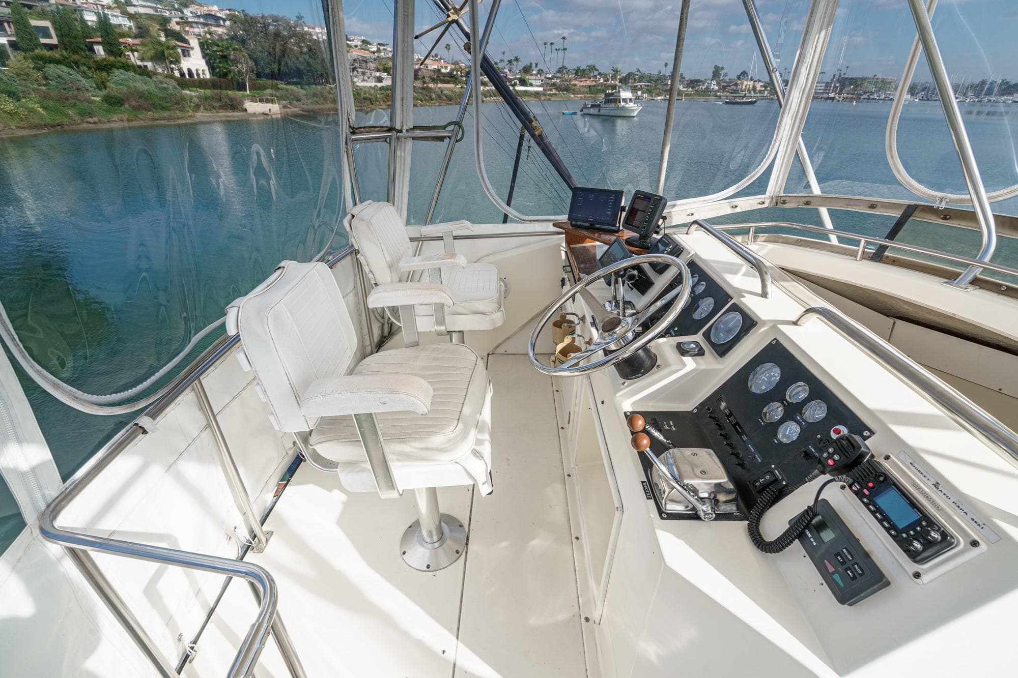 1989 Pearson 34 Convertible yacht helm with dual seats and navigational controls.