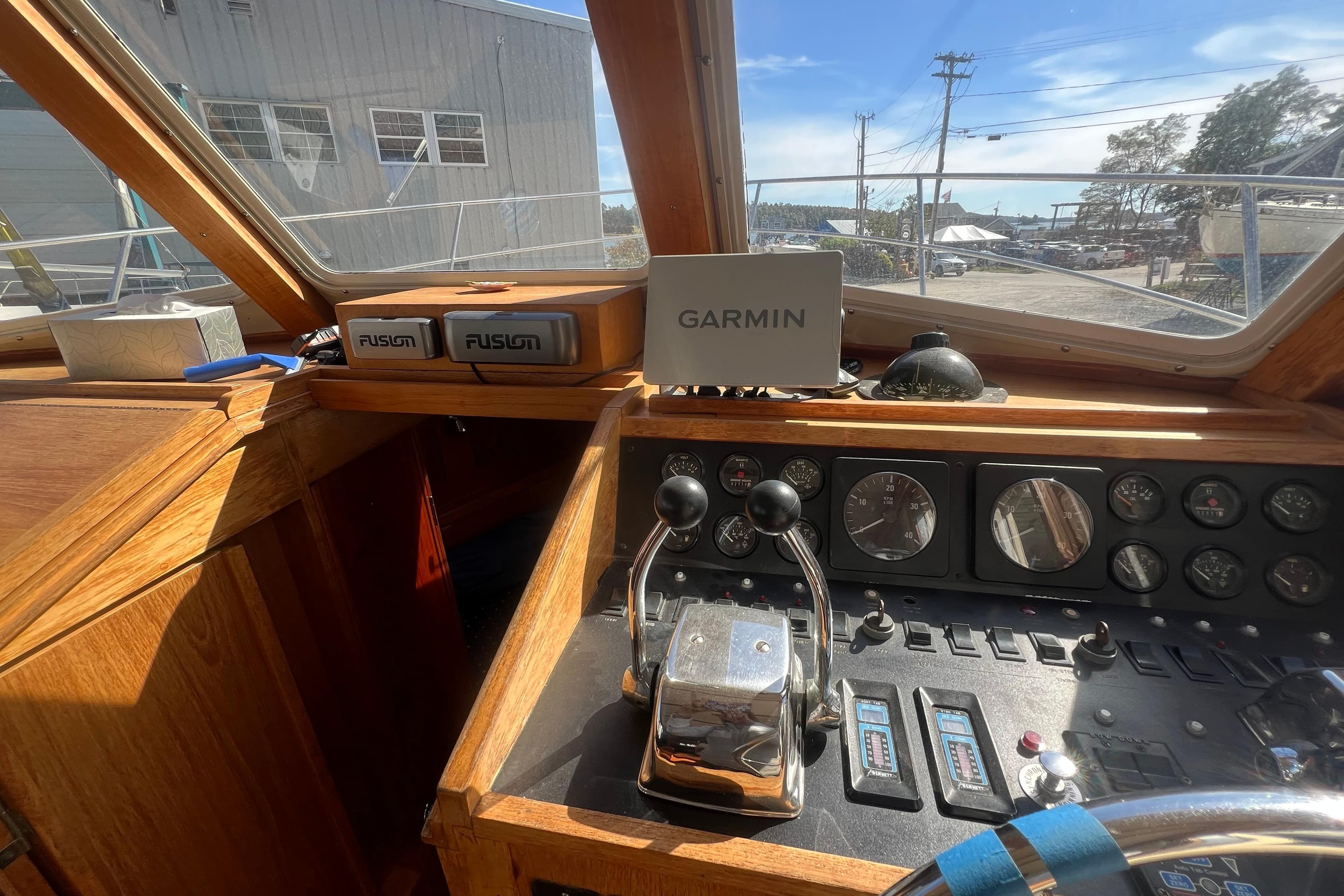 1990 Sabreline 36 Fast Trawler helm with Garmin navigation and Fusion audio system.
