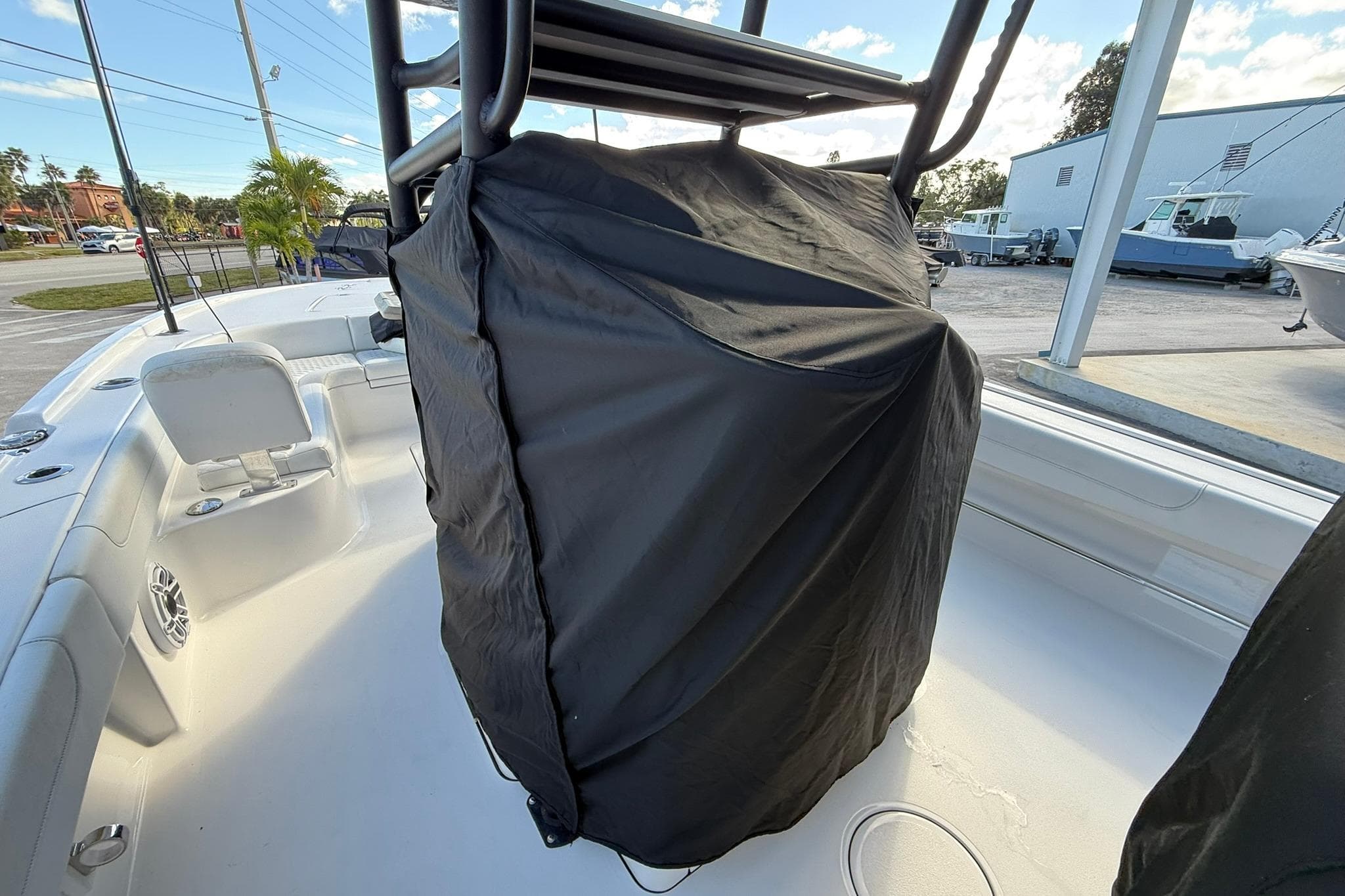 2023 Caymas 28 HB Twin boat interior with covered console, outdoor setting.