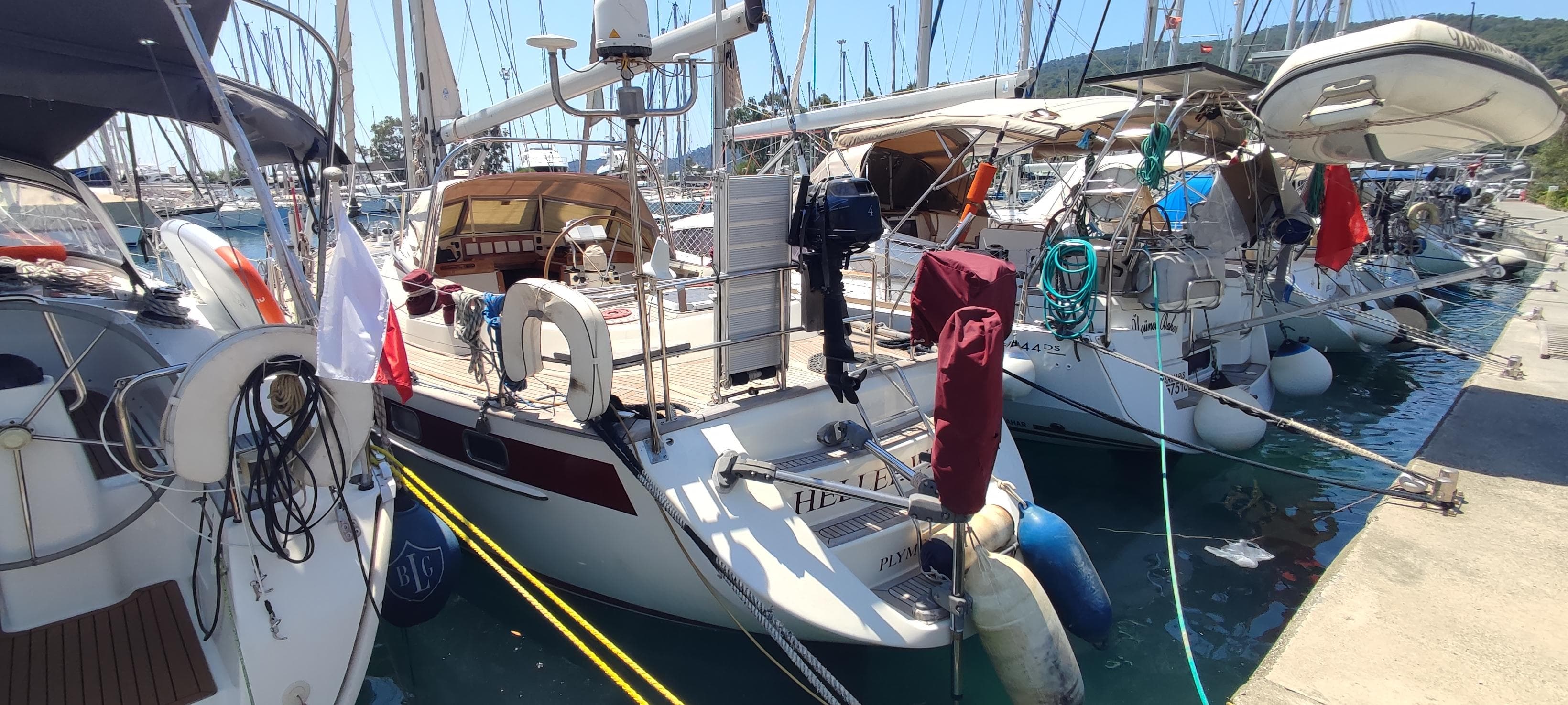 Najad 440 sailboats docked in a marina, showcasing their elegant design and nautical equipment.