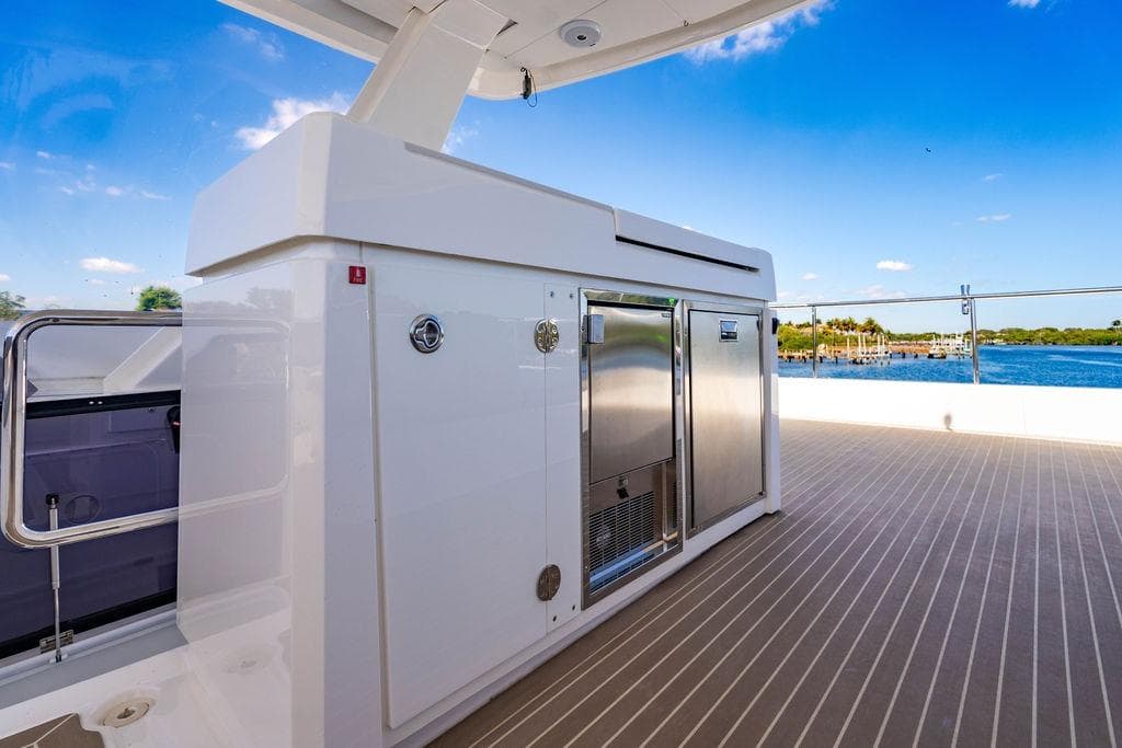 Leopard 53 Powercat 2022 yacht deck with sleek cabinetry and ocean view.